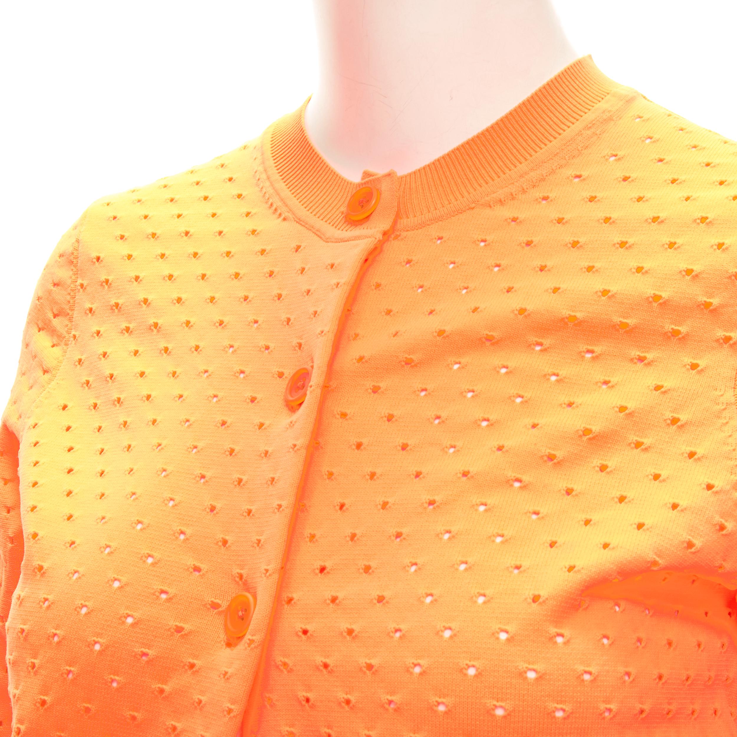 ACNE STUDIO neon orange perforated cropped cardigan sweater S 
Reference: ANWU/A00724 
Brand: Acne Studios 
Material: Feels like cotton 
Color: Orange 
Pattern: Solid 
Closure: Button 

CONDITION: 
Condition: Excellent, this item was pre-owned and