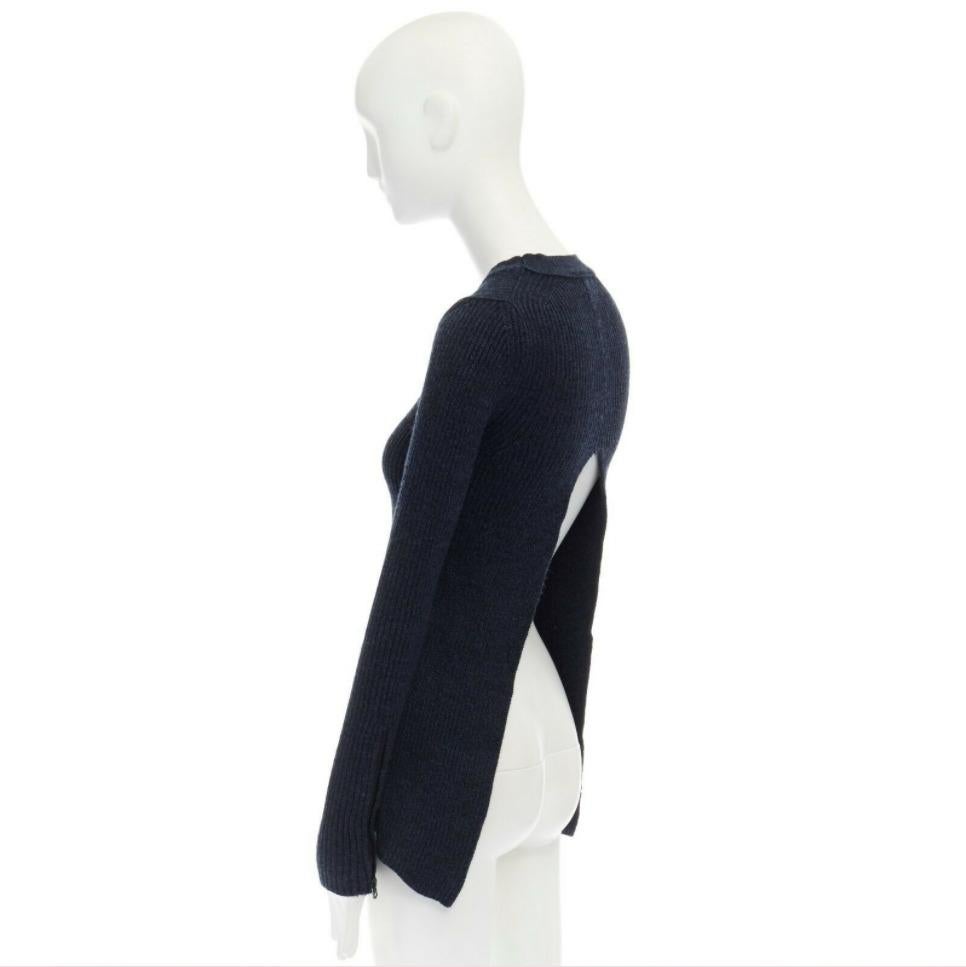 ACNE STUDIOS ARCHIVE dark blue split open back ribbed knitted sweater top Reference: JETI/A00116 
Brand: Acne Studios 
Color: Blue 
Pattern: Solid 
Closure: Zip 
Extra Detail: Dark blue. Round neck. Ribbed neckline. Ribbed knit. Split open back.