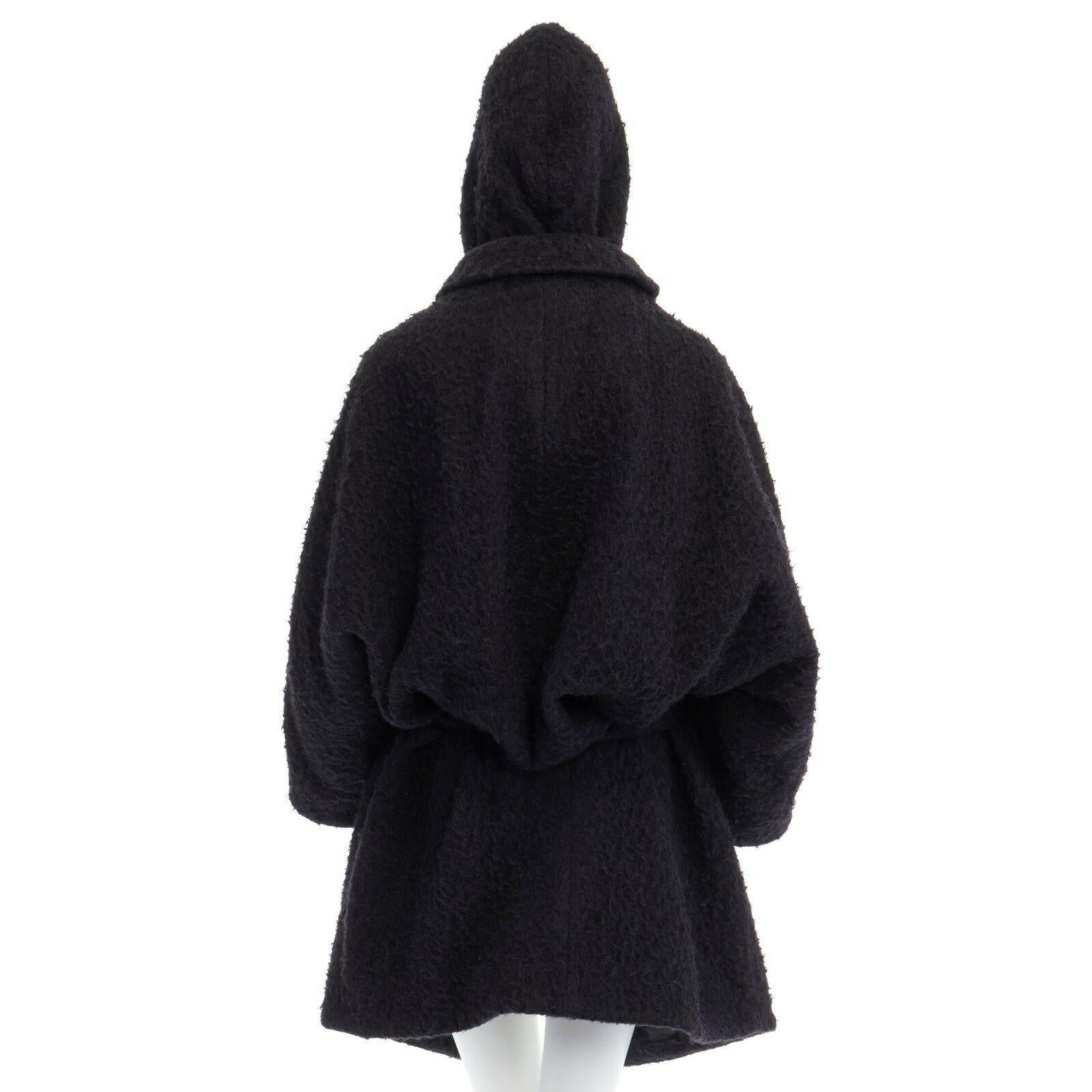 ACNE STUDIOS AW11 Sylvia black wool blend belted voluminous oversized coat FR34S

ACNE STUDIOS
FROM THE FALL WINTER 2011 COLLECTION
Sylvia coat. Wool, alpaca, mohair blend. Black textured wool outer. Concealed button front closure. Detachable hood.