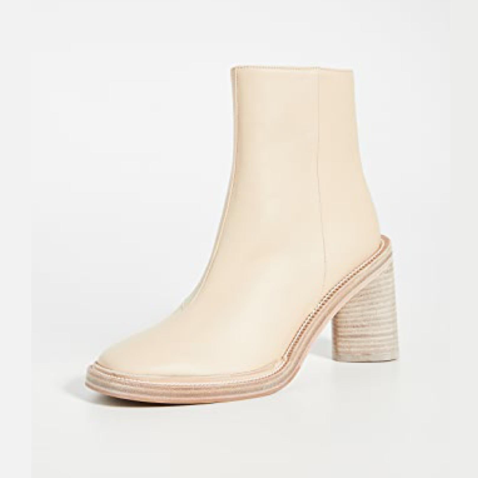The ankle boots are made with supple lamb leather in beige and feature a squared toe, a triangular stacked block heel measuring 90 mm (3.5”) and an inner tonal zip fastening.
Style ID: FN-WN-SHOE000260

COLOR: Beige
MATERIAL: Lamb leather uppers,