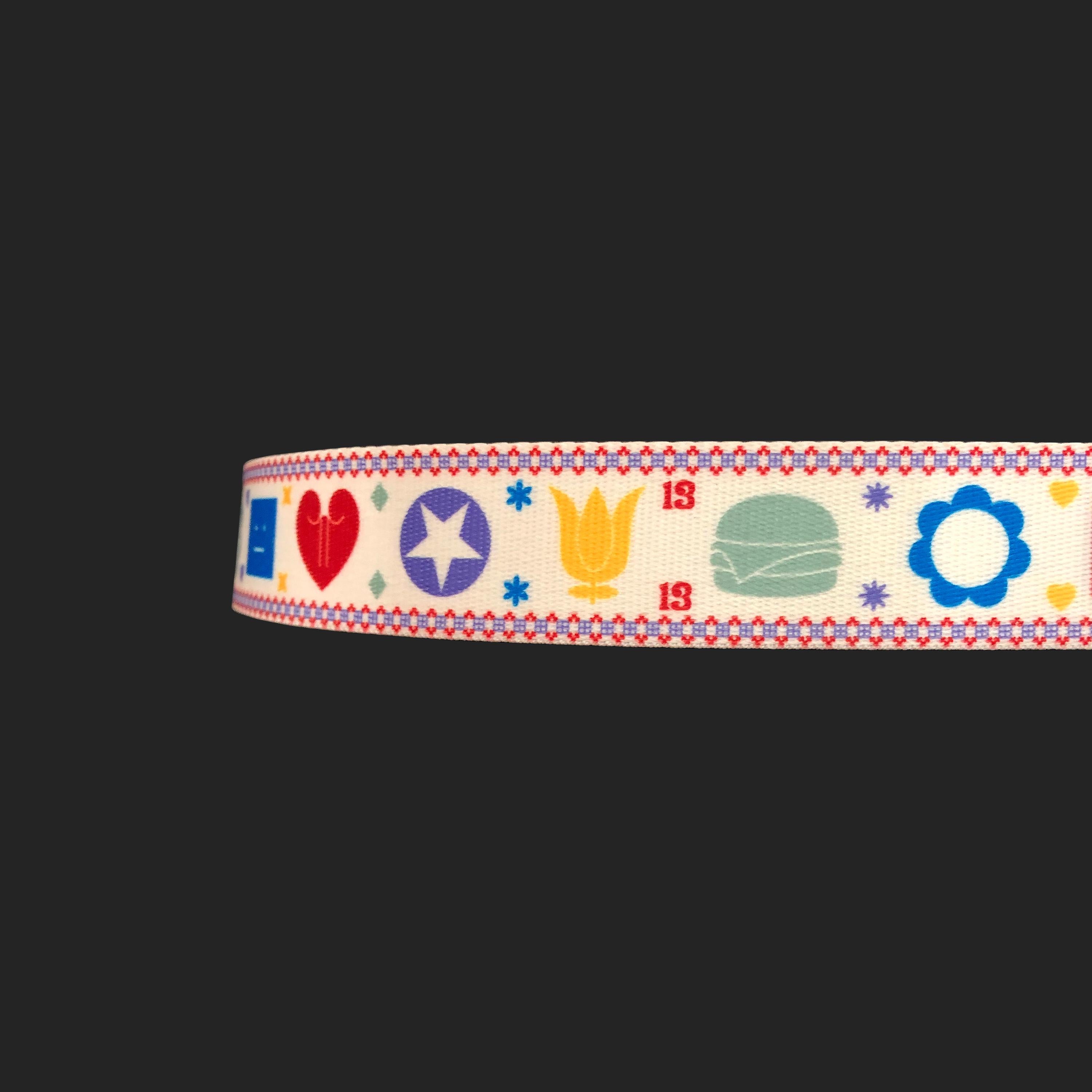 Product Details: Acne Studios Belt - Coated Canvas + ‘Lotus, Burger, Heart, Daisy, Cassette & Star Emoji Weave - Silver Metal Belt Buckle & Tip 
Label: Acne Studios
Fabric Content: Coated Canvas Belt / Silver Metal Buckle
Size: Freesize
Maximum Belt