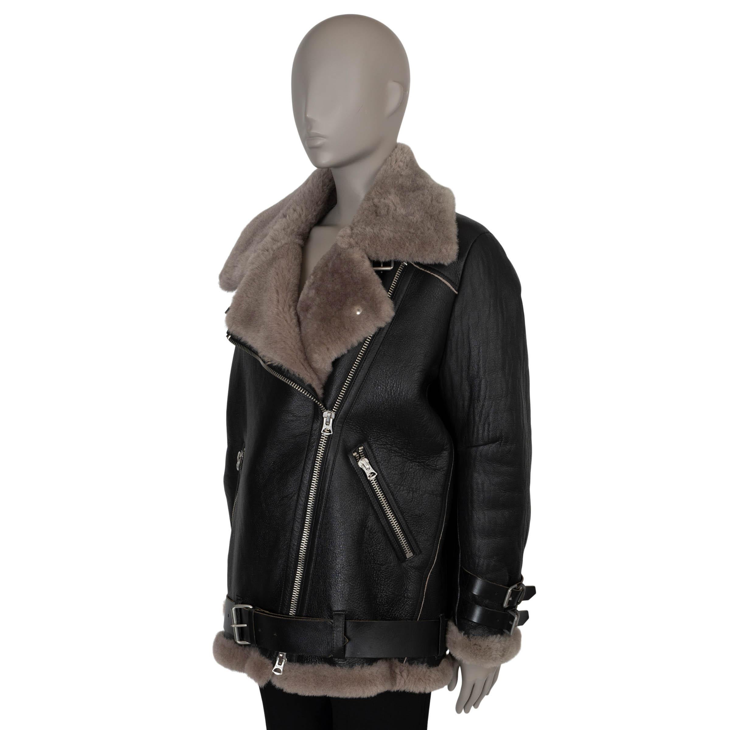 This 100% authentic Acne Studios Velocite biker jacket in black leather is an iconic piece that has become a fashion staple, seen on style icons from Kendall Jenner to Hailey Bieber. Lined in cozy taupe shearling, it features an oversized silhouette
