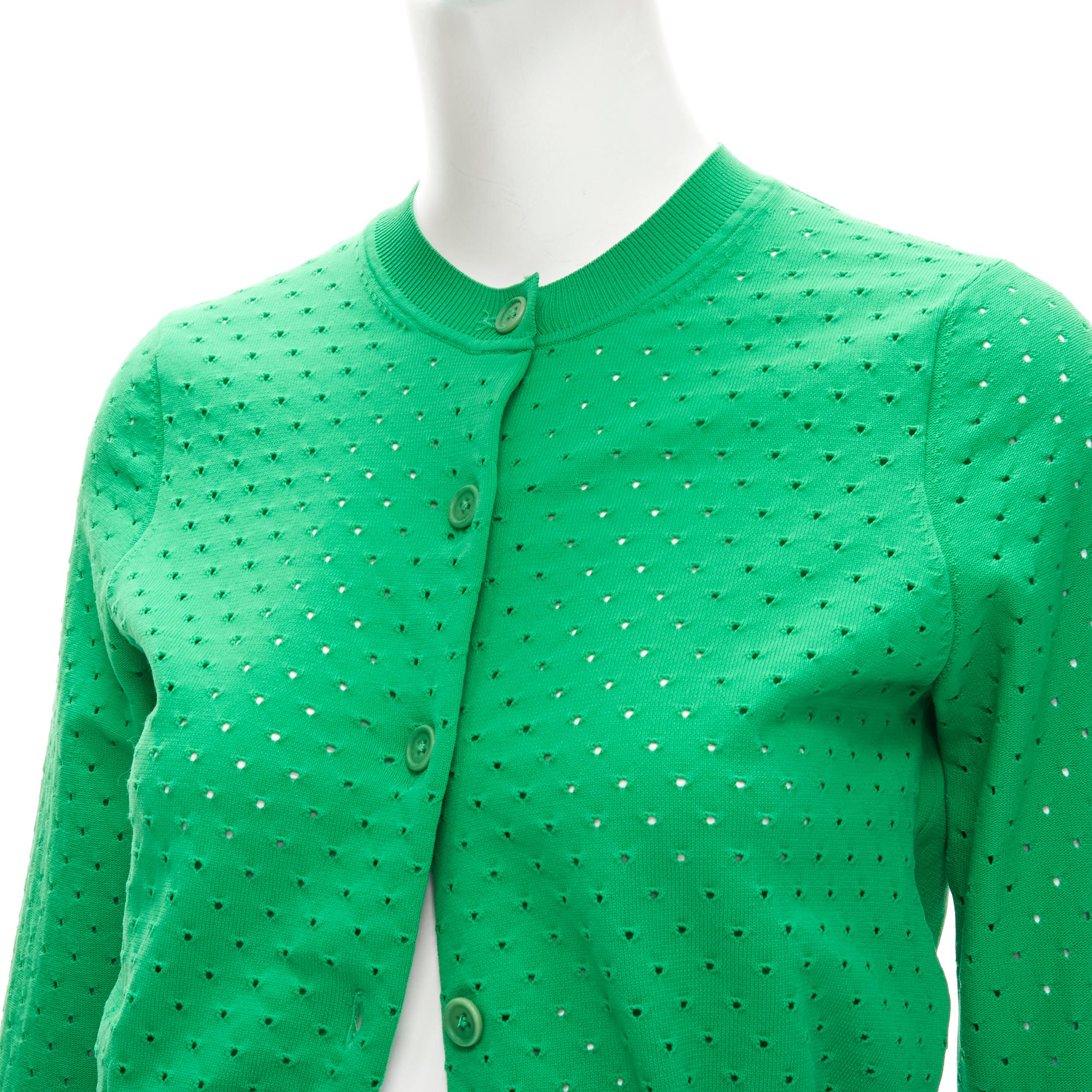 ACNE STUDIOS kelly green perforated cropped cardigan sweater S 
Reference: ANWU/A00725 
Brand: Acne Studios 
Material: Feels like cotton 
Color: Green 
Pattern: Solid 
Closure: Button 

CONDITION: 
Condition: Excellent, this item was pre-owned and