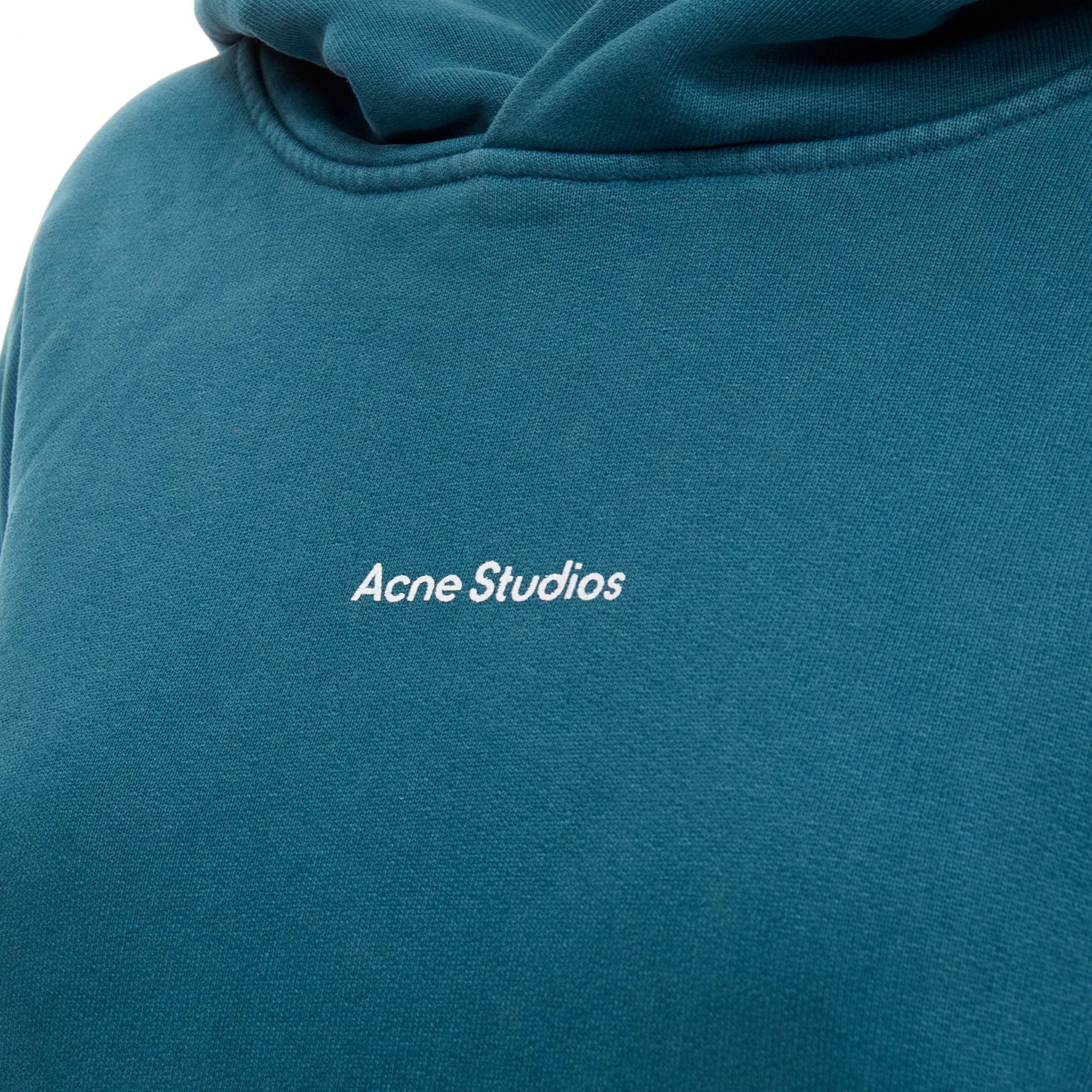 ACNE STUDIOS logo print washed cotton turquoise blue oversized hoodie M 
Reference: KEDG/A00073 
Brand: Acne Studios 
Material: Cotton 
Color: Blue 
Pattern: Solid 
Extra Detail: Kangroo pockets. 
Made in: Portugal 

CONDITION: 
Condition: Very