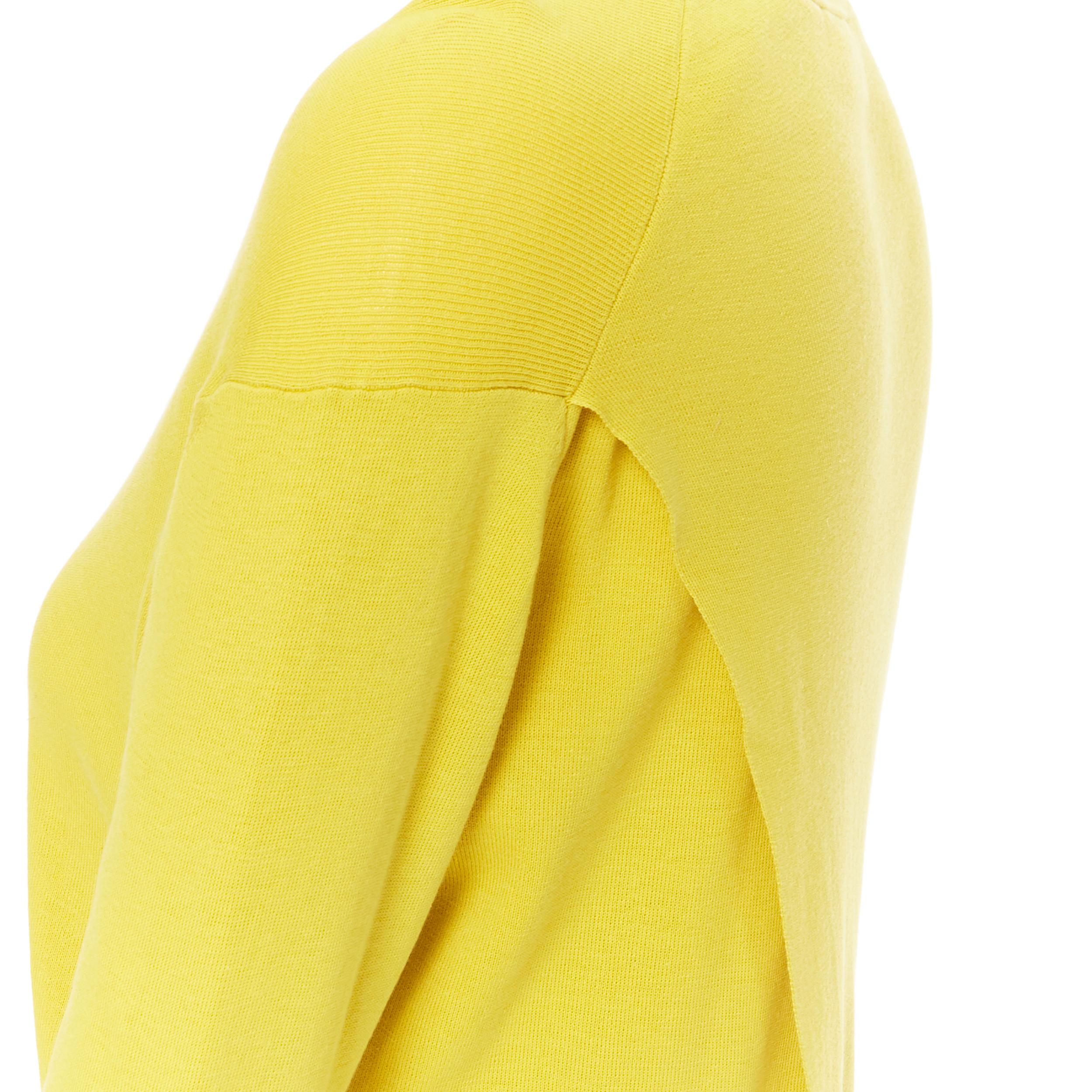 ACNE STUDIOS Materia SS15 100% cotton split back sweater top S 
Reference: JETI/A00179 
Brand: Acne Studios 
Collection: Spring Summer 2015 
Material: Cotton 
Color: Yellow 
Pattern: Solid 
Made in: China 

CONDITION: 
Condition: Very good, this
