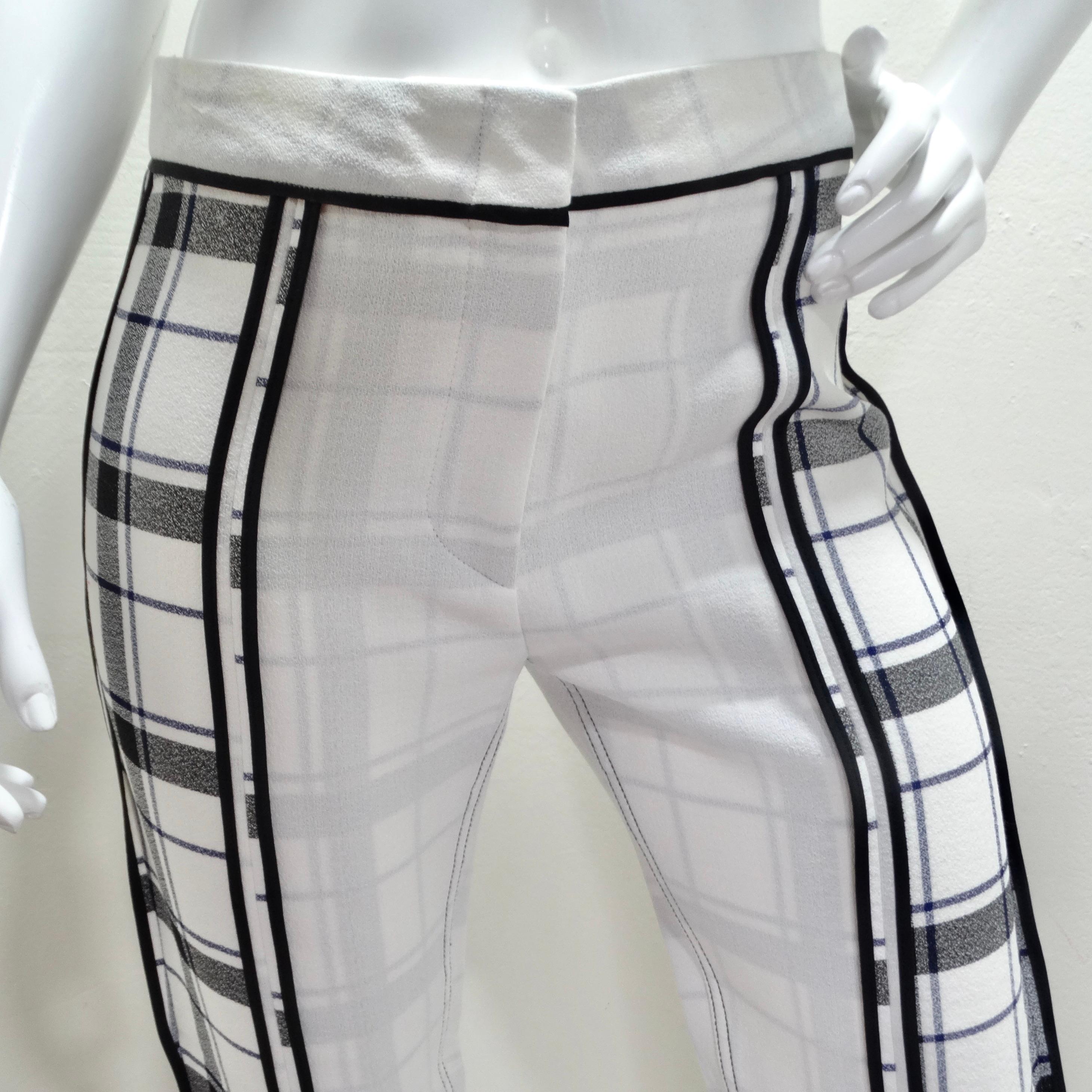 Introducing the Acne Studios Plaid Trousers – a fusion of modern sophistication and timeless style. These women's semi-cropped white trousers are designed to elevate your wardrobe with their unique blend of black and white plaid panels and black