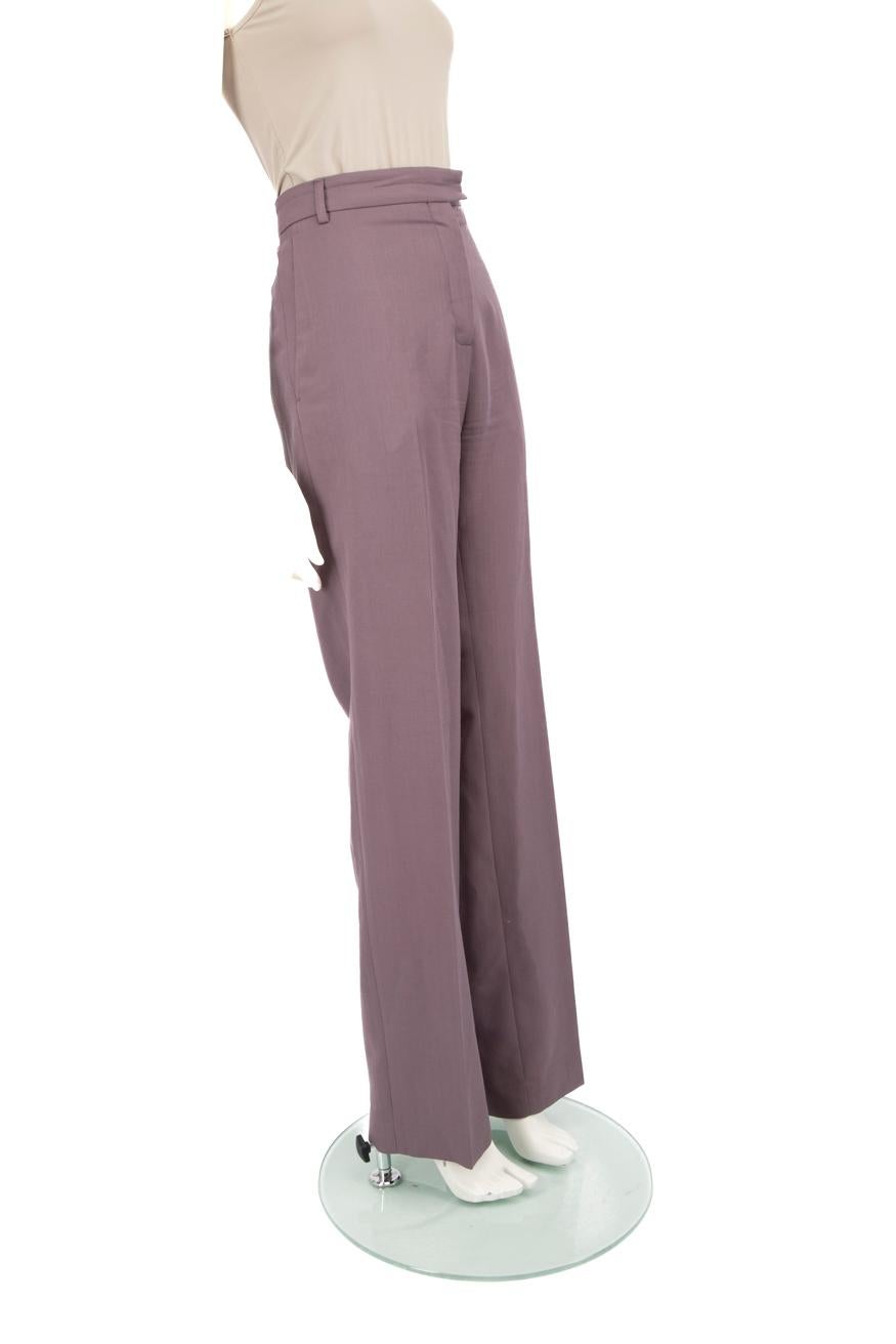 CONDITION is Very good. Minimal wear to the trousers is evident. Two pulls to the weave on the front right trouser leg. Light discolouration on the front waist band facing, both front hems and mid way down the back of both legs on this used Acne