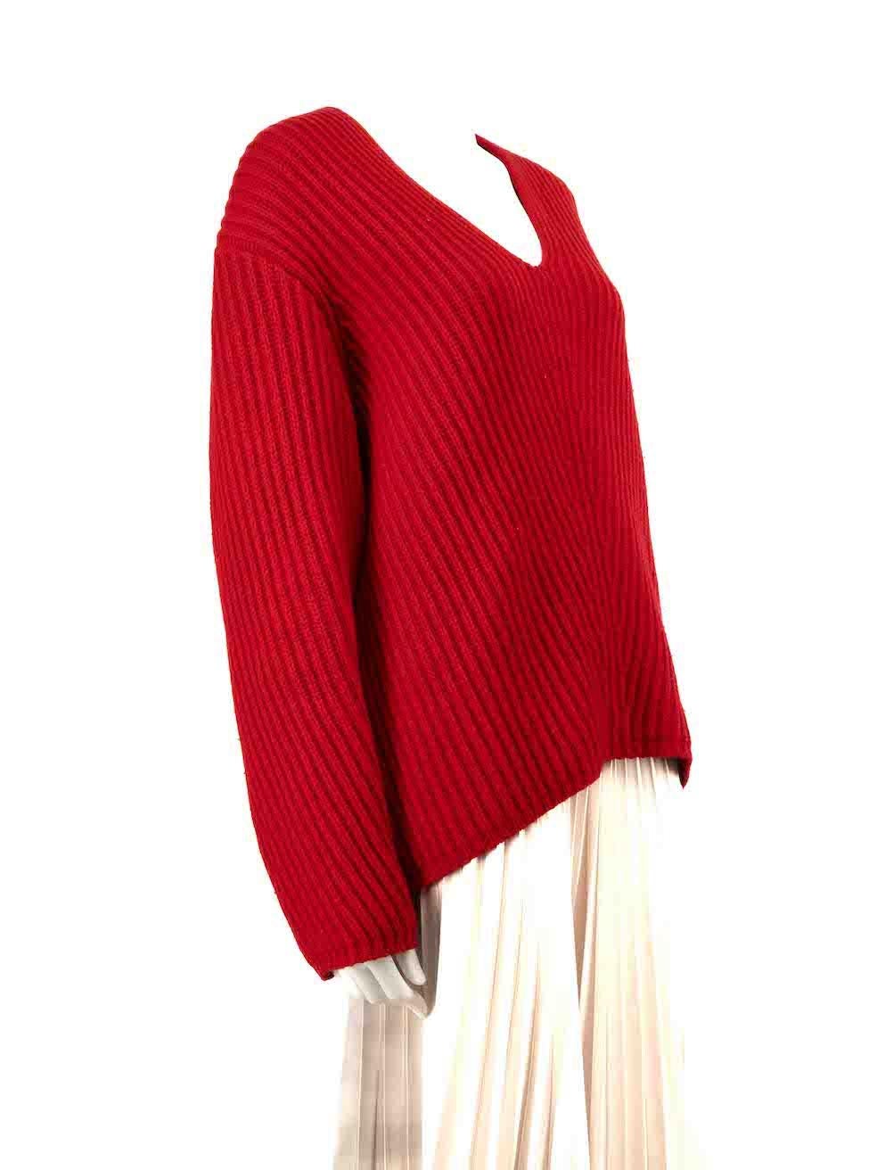 CONDITION is Good. Minor wear to jumper is evident. Light wear to the knitted surface which shows mild pilling throughout on this used Acne Studios designer resale item.
 
 Details
 Red
 Wool
 Knit jumper
 V-neck
 Long sleeves
 
 
 Made in China
 
