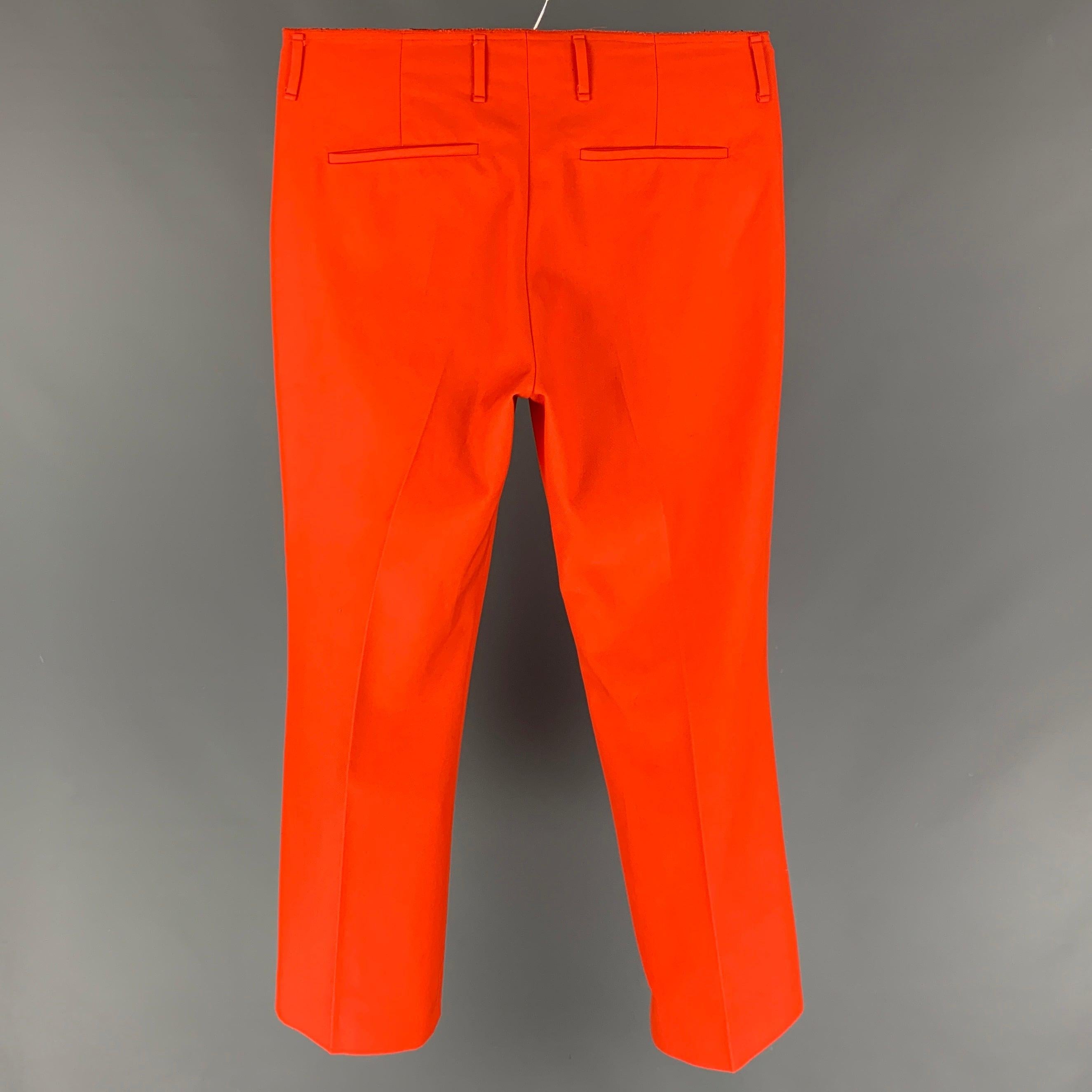 ACNE STUDIOS pants comes in a orange cotton / polyester featuring a flat front, raw edge, and a zip fly closure. Made in Romania.
 Very Good
 Pre-Owned Condition. 
 

 Marked:  48 
 

 Measurements: 
  Waist: 32 inches Rise: 11 inches Inseam: 30