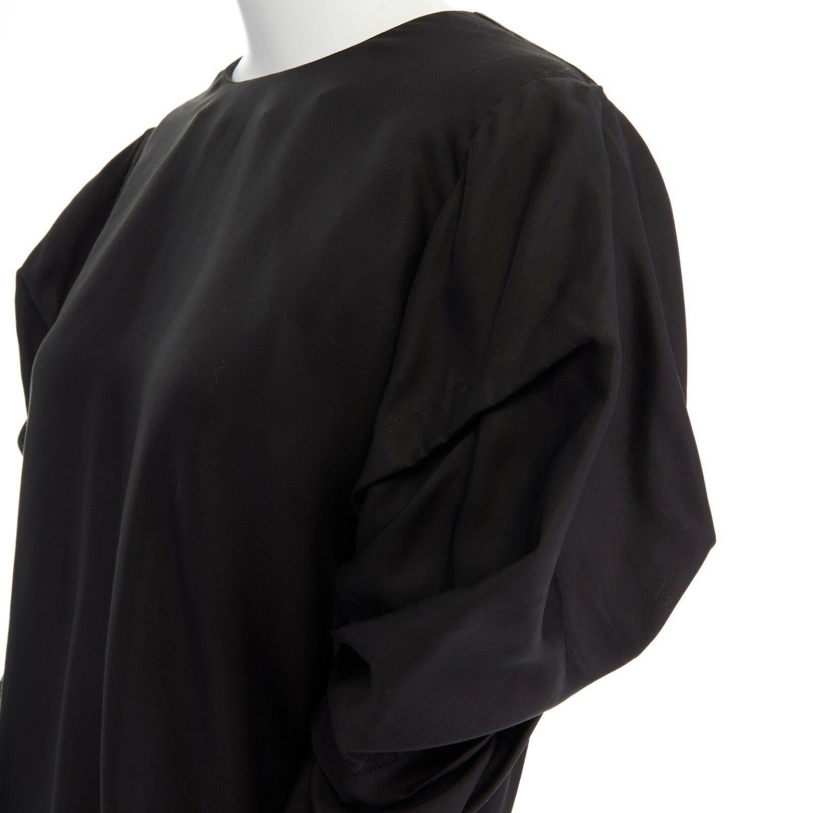 ACNE STUDIOS SS13 Ava Fluid black pleated voluminous long sleeve top FR34 XS

ACNE STUDIOS
FROM THE SPRING SUMMER 2013 COLLECTION
Ava Fluid top. Lyocell, vicose. Black. Round neckline. Pleated voluminous detail at arm. Long sleeves. Zipper at cuff.