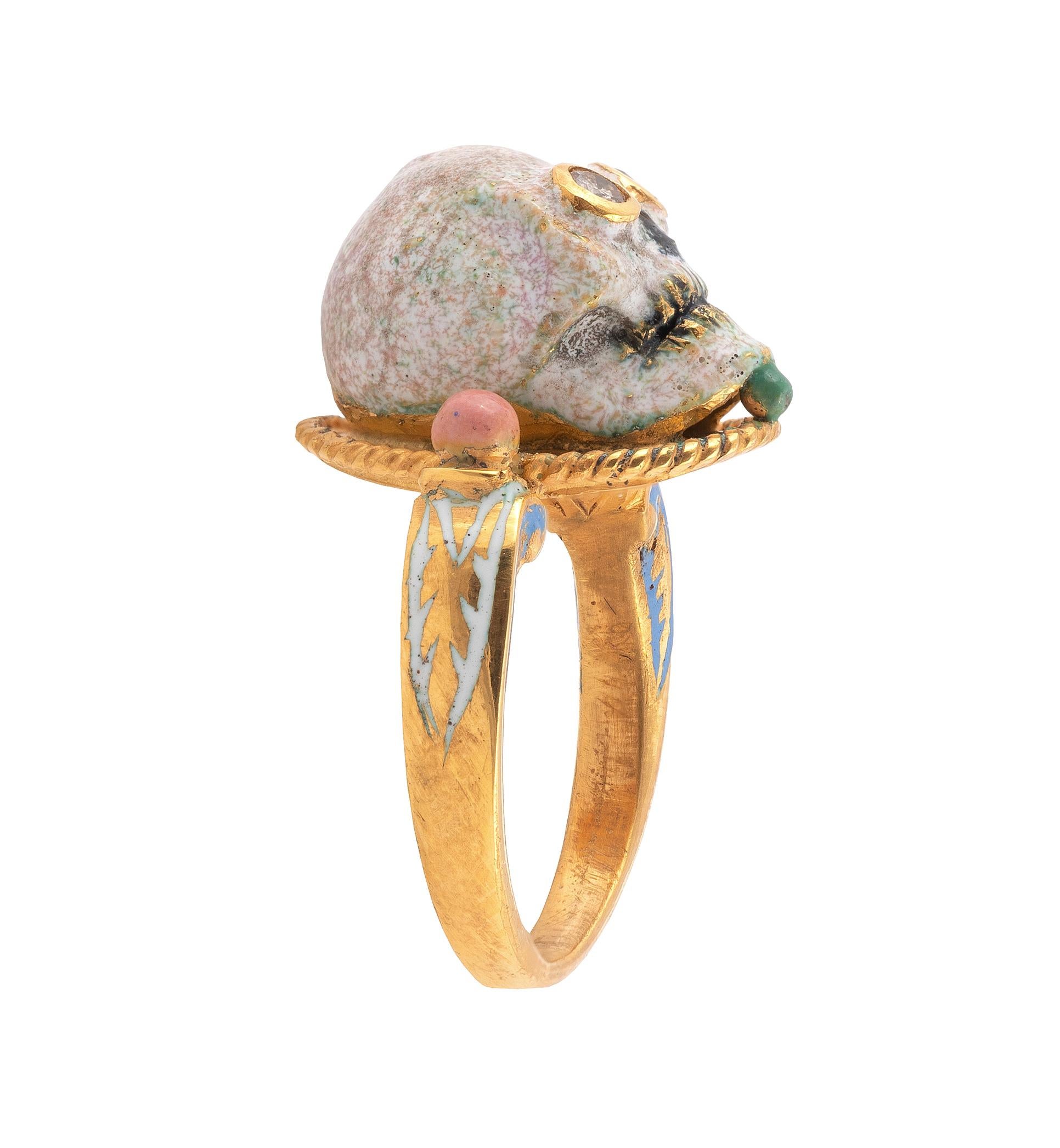 Renaissance style Memento Mori skull ring made with champleve multicolored enamels.
Mounted in 18Kt gold Signed A. Codognato Venezia Weight: 12 gr Finger size: 7 1/4