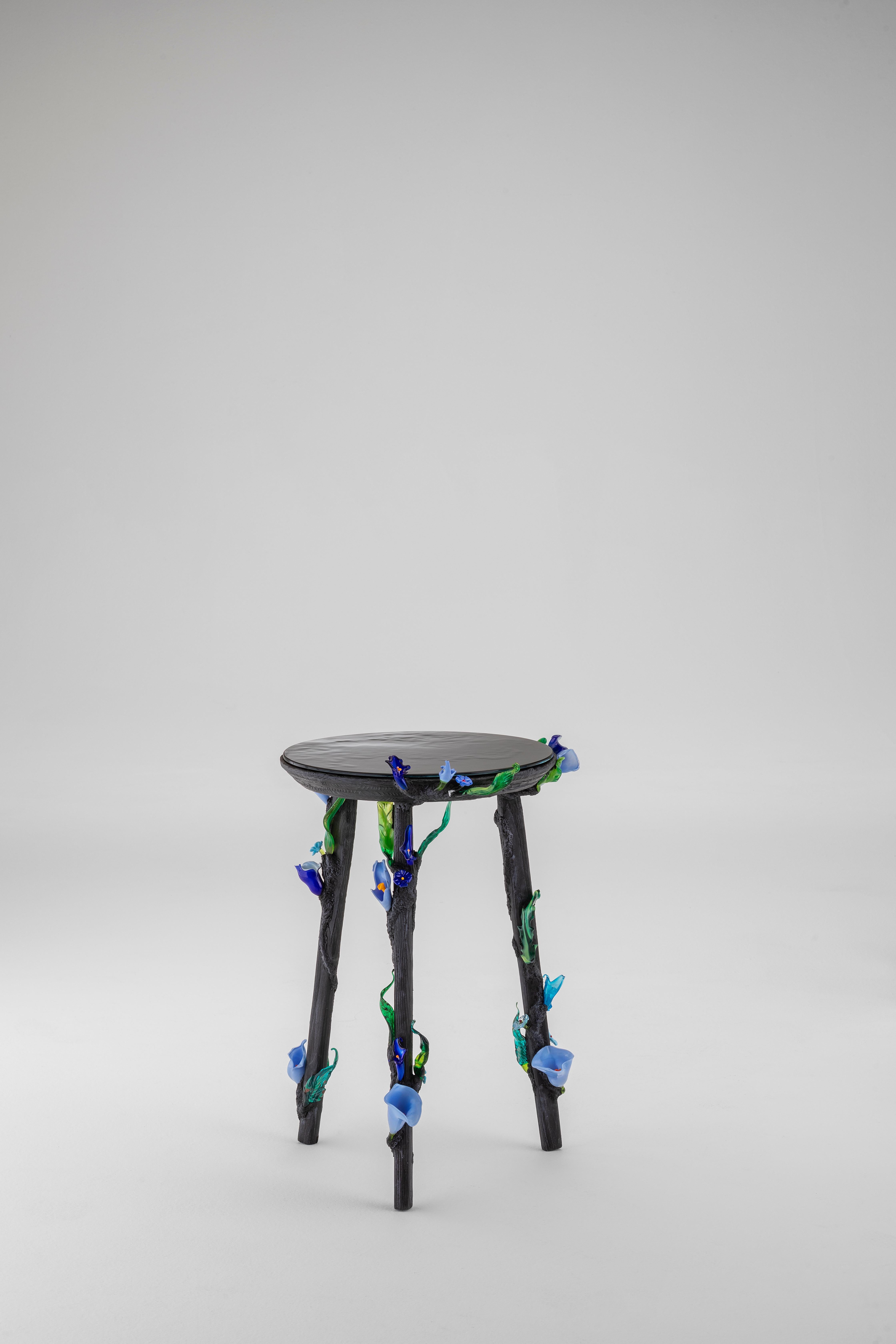Aconito Side Table by Vetralia
Designed by Alessandro Trambaioli
Dimensions:  D 45 x H 60 cm
Materials: Charred wood, resin, Murano glass.

VETRALIA
Functional Art based in Venice
Active in the collectible design proposal, Vetralia is a meeting