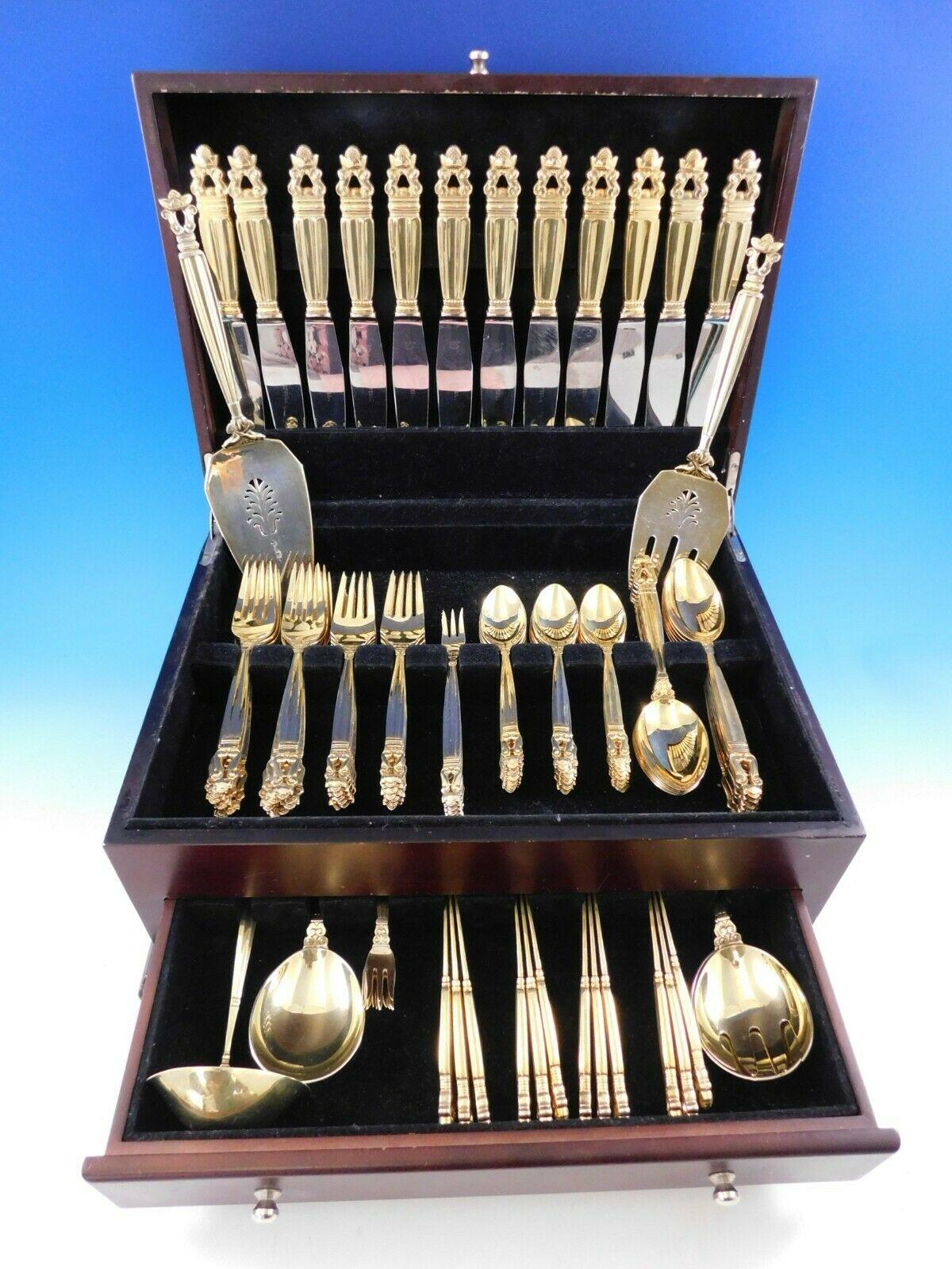 Exceptional dinner size vermeil (lightly gold-washed) acorn by Georg Jensen sterling silver flatware set, 102 pieces. This set includes:

12 dinner knives, 9