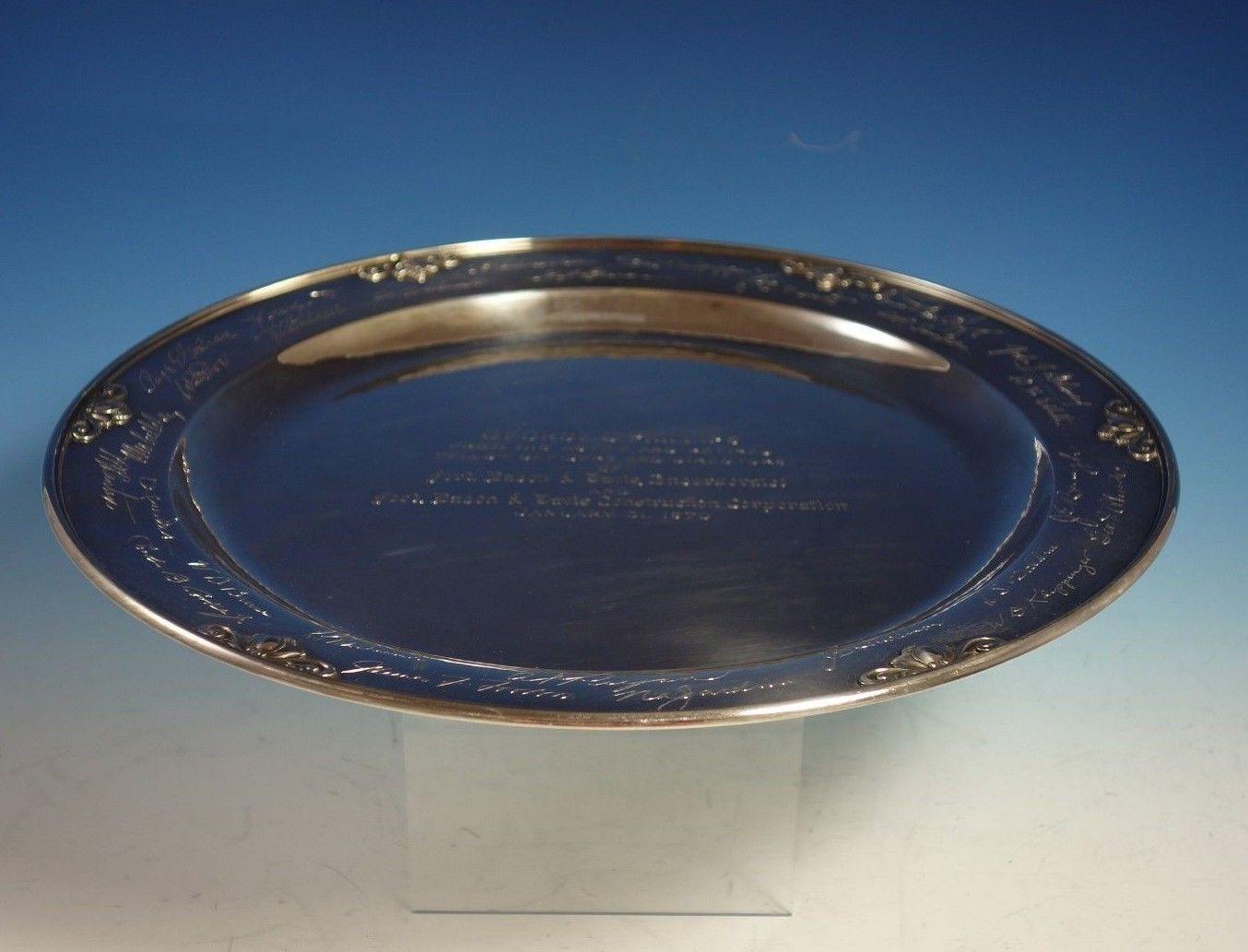 Gorgeous Acorn by Georg Jensen sterling silver round serving tray / plate/ platter marked #642C. The platter has an inscription and was presented to George O. Phillips from Ford, Bacon & Davis Inc. Construction Co. January 31, 1970. 
The platter
