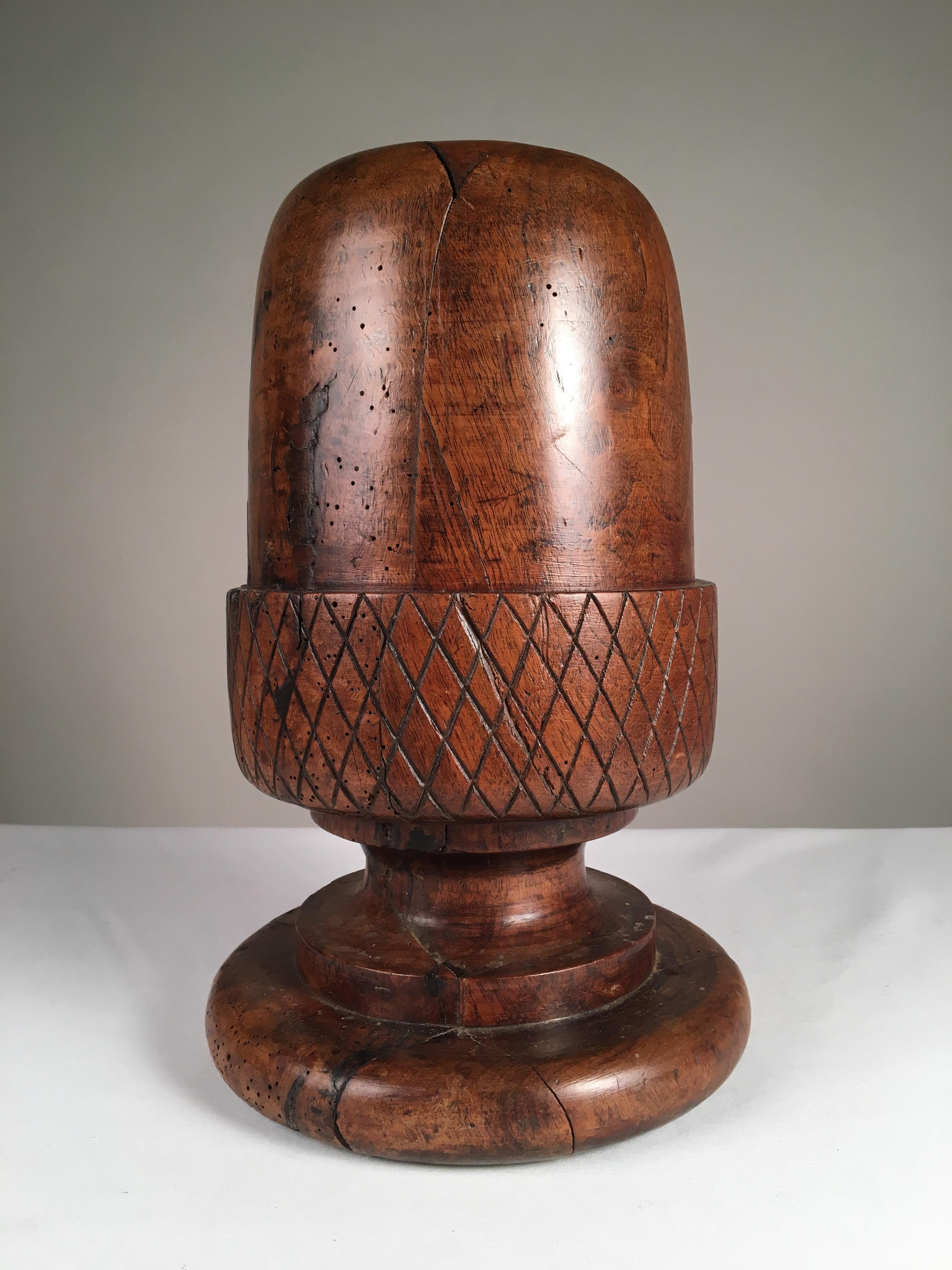 A French 18th century wig stand, acorn form in carved walnut. From the estate of Pierre Moulin, founder of the Pierre Deux shops.