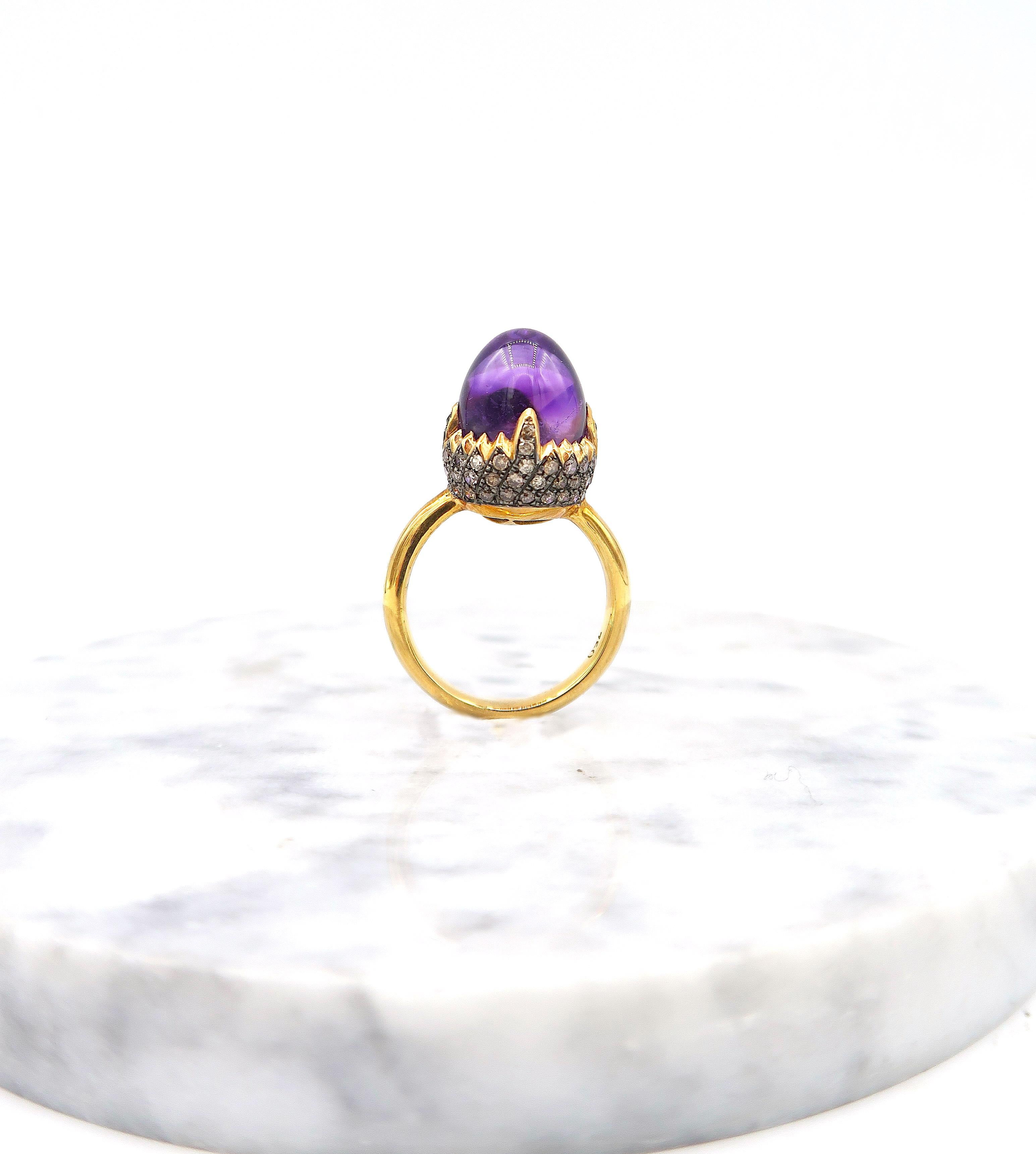 Acorn-Shaped Amethyst with Pavé Champagne/ Brown Diamond Cupule Ring in 18K Gold

Gold: 18K Gold 7.20g.
Champagne Diamond: 1.14ct.
Amethyst: 9.31cts.

Ring size: US 7
Please let us know should you wish to have the ring resized.