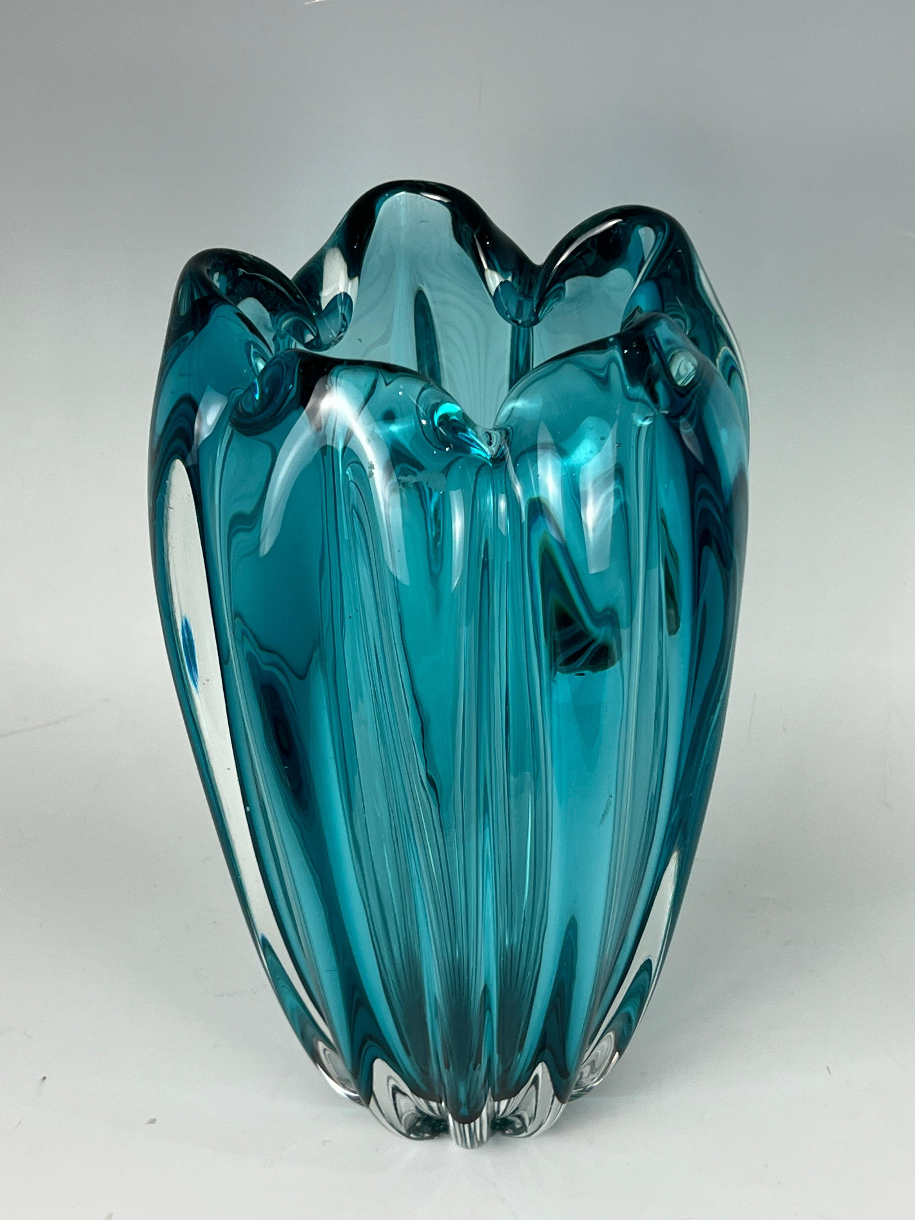 A scalloped Murano glass vase in Acqua color.
Made in Italy
Circa: 1990.