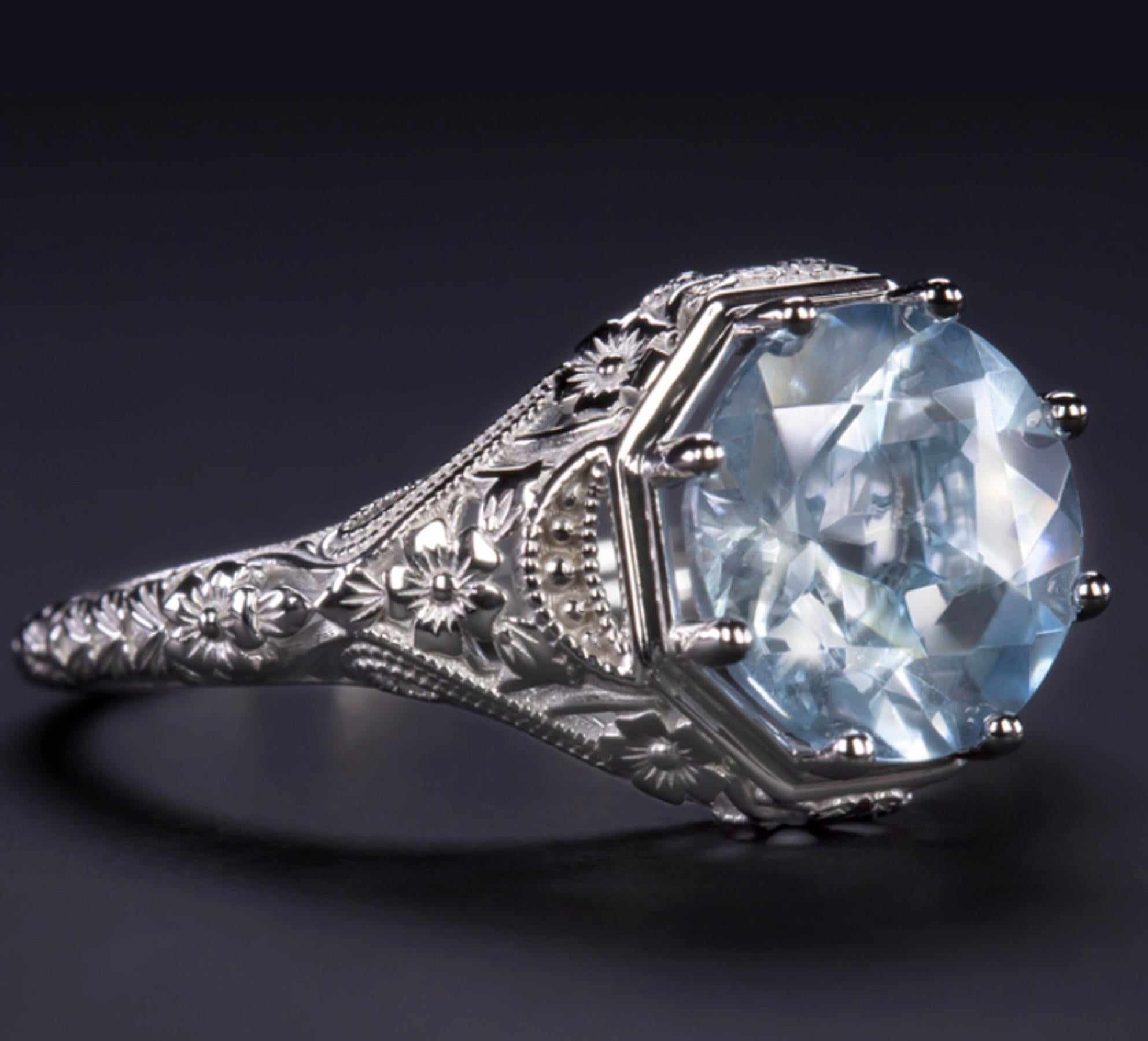 Stunning aquamarine ring offers rich colors and a romantic, timeless design! 

This natural 2.30 carat aquamarine blue is well saturated and vibrant, reminiscent of the sky on a summer day. 

Aquamarine has a magnificent brilliance and life with a
