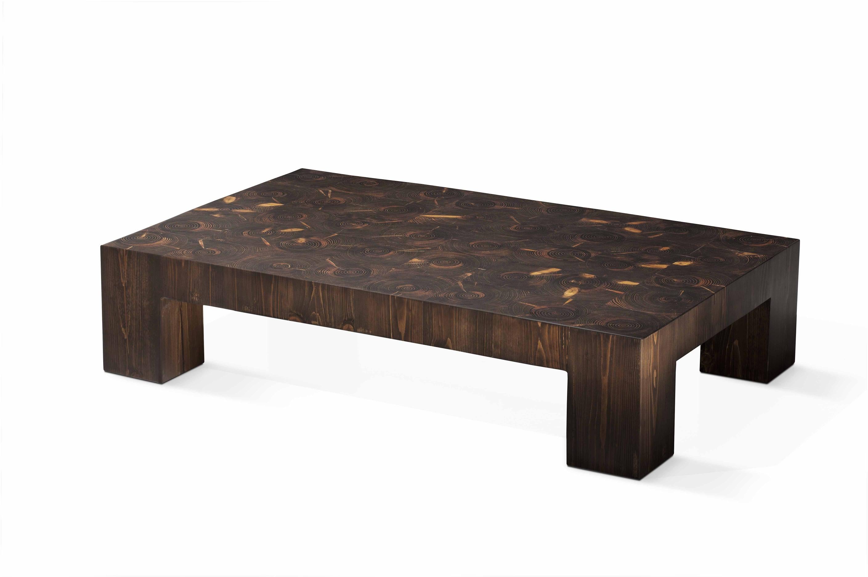 Table basse Across The Universe de Francesco Profili
Dimensions : L 120 x D&H 75 x H 27 cm 
MATERIAL : Bois massif, résine.

L'élégance d'une forme simple, la richesse naturelle du bois, la magie de la lumière.
La table transmet une atmosphère