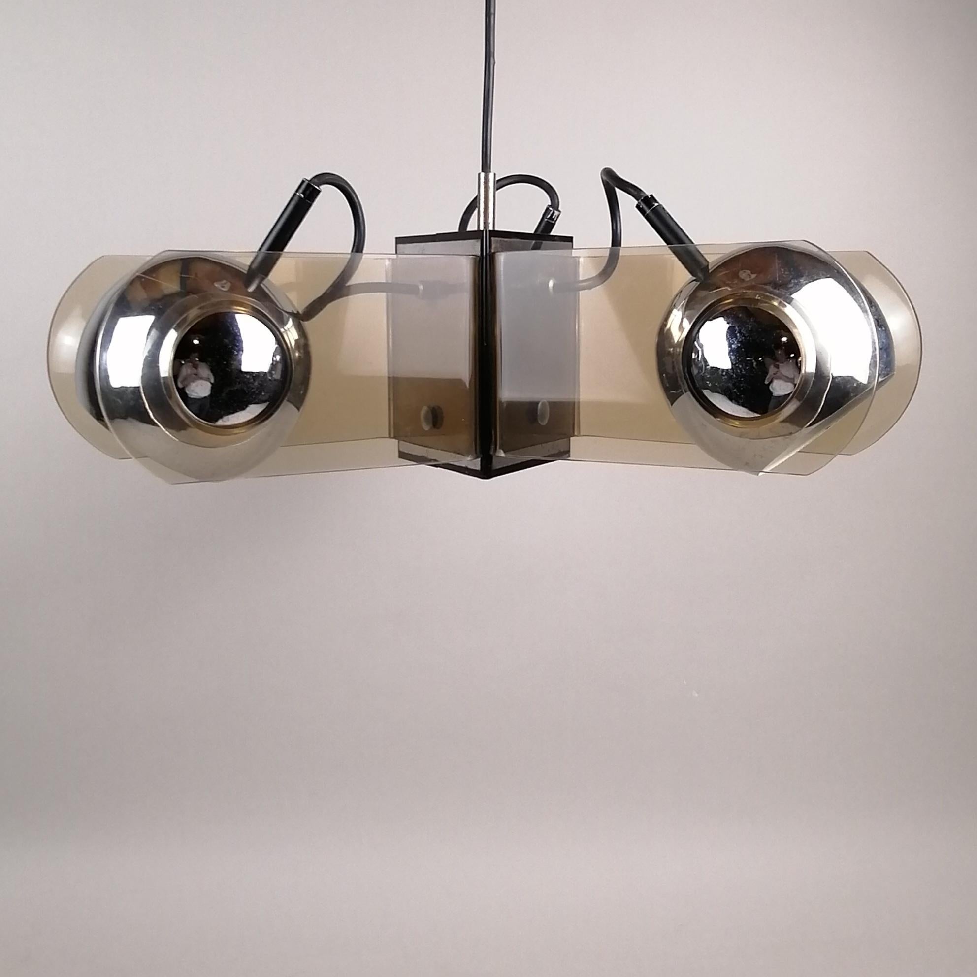 An acrylic and chrome metal ceiling lamp in the style of Gino Sarfatti. The smoked acrylic structure shows 3 adjustable chrome spheres.