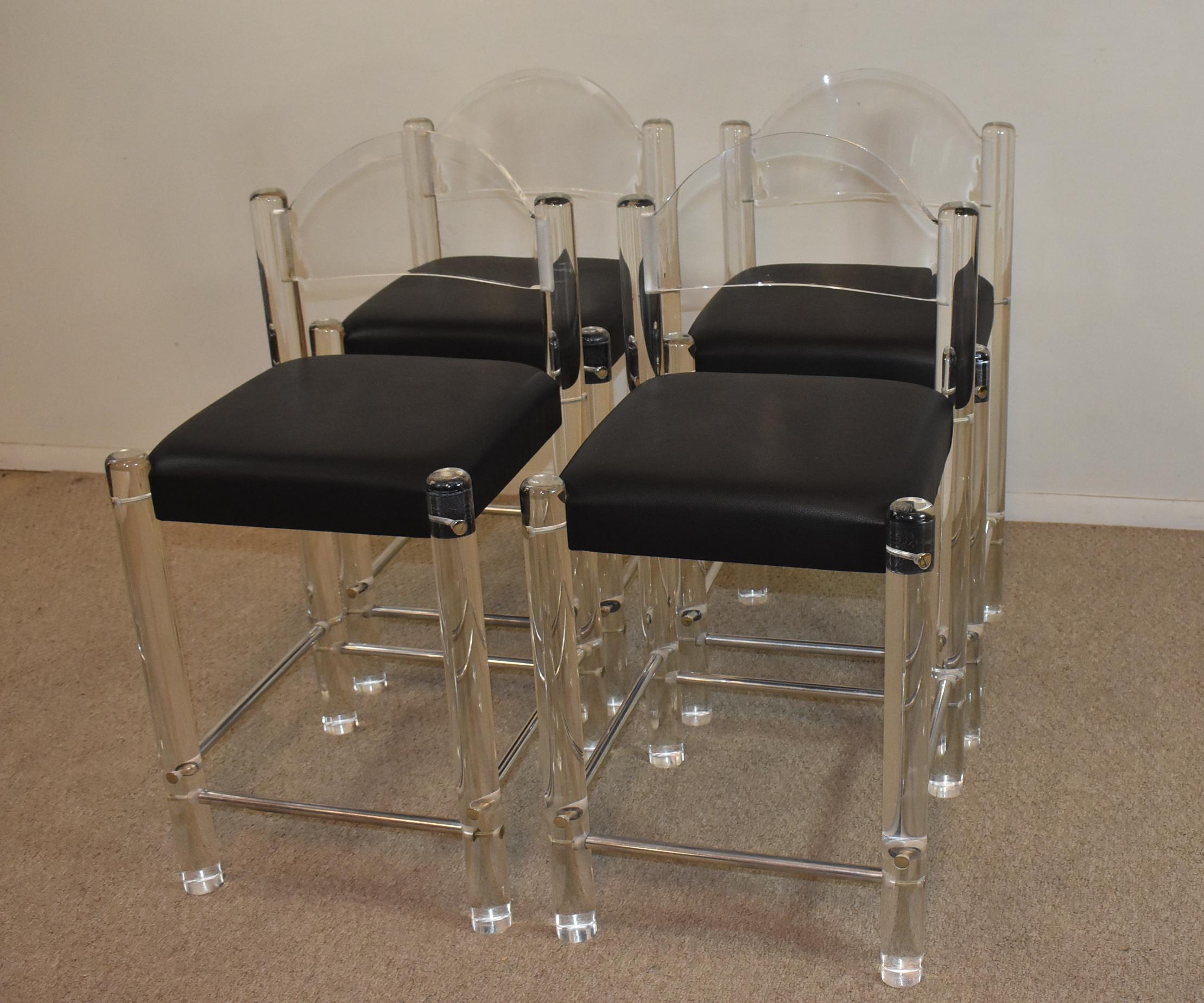 Set of 4 unique counter height bar stools with tubular acrylic legs, chrome stretchers and black leather seats. The acrylic backs are curved, legs are 2