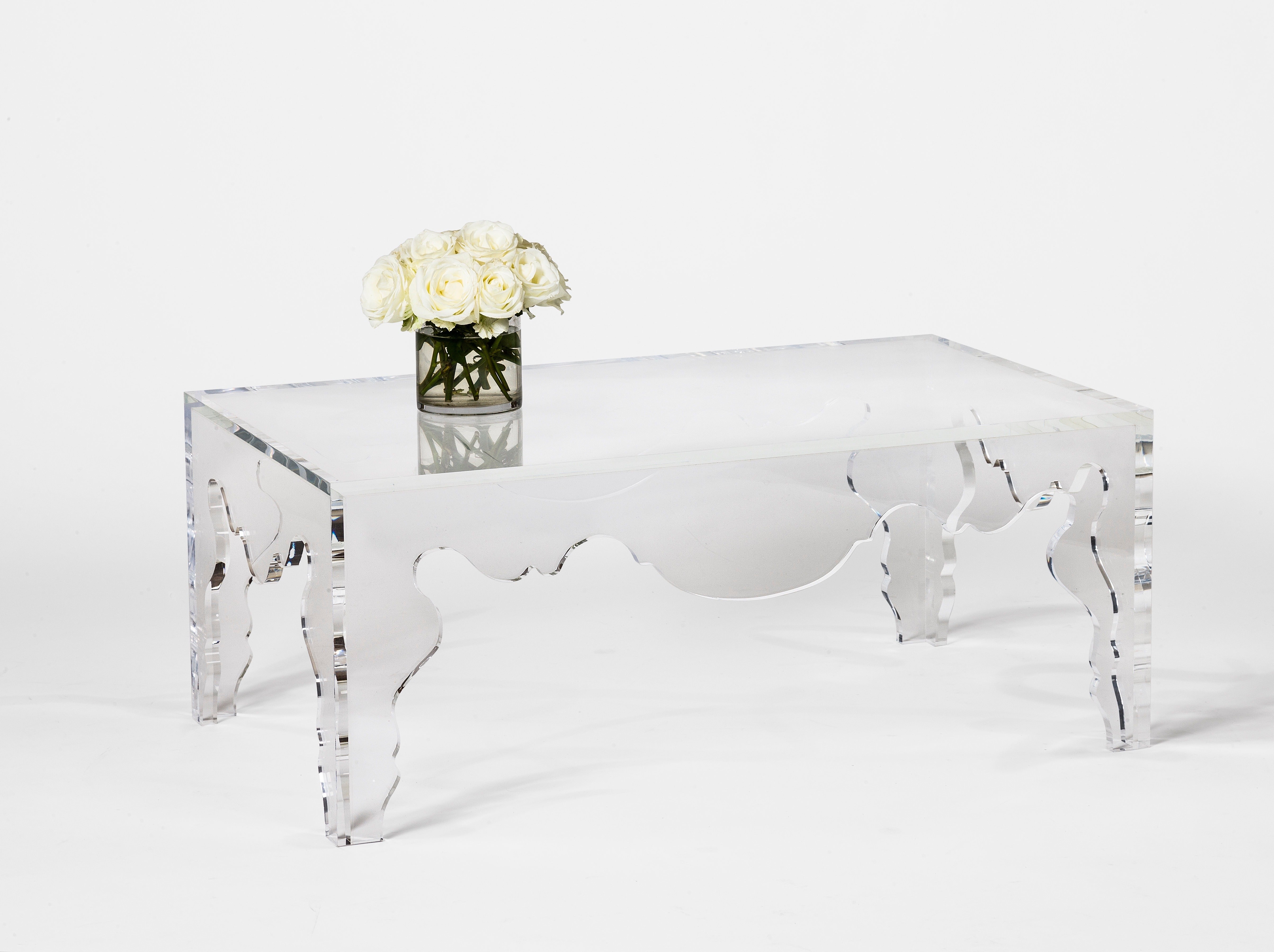 Bringing a modern edge to Classic design, this acrylic Rococo coffee table from the custom Tara Shaw Maison collection will make a statement in any space. Pairs with acrylic Rococo console and martini tables. Handcrafted in New Orleans.

Custom
