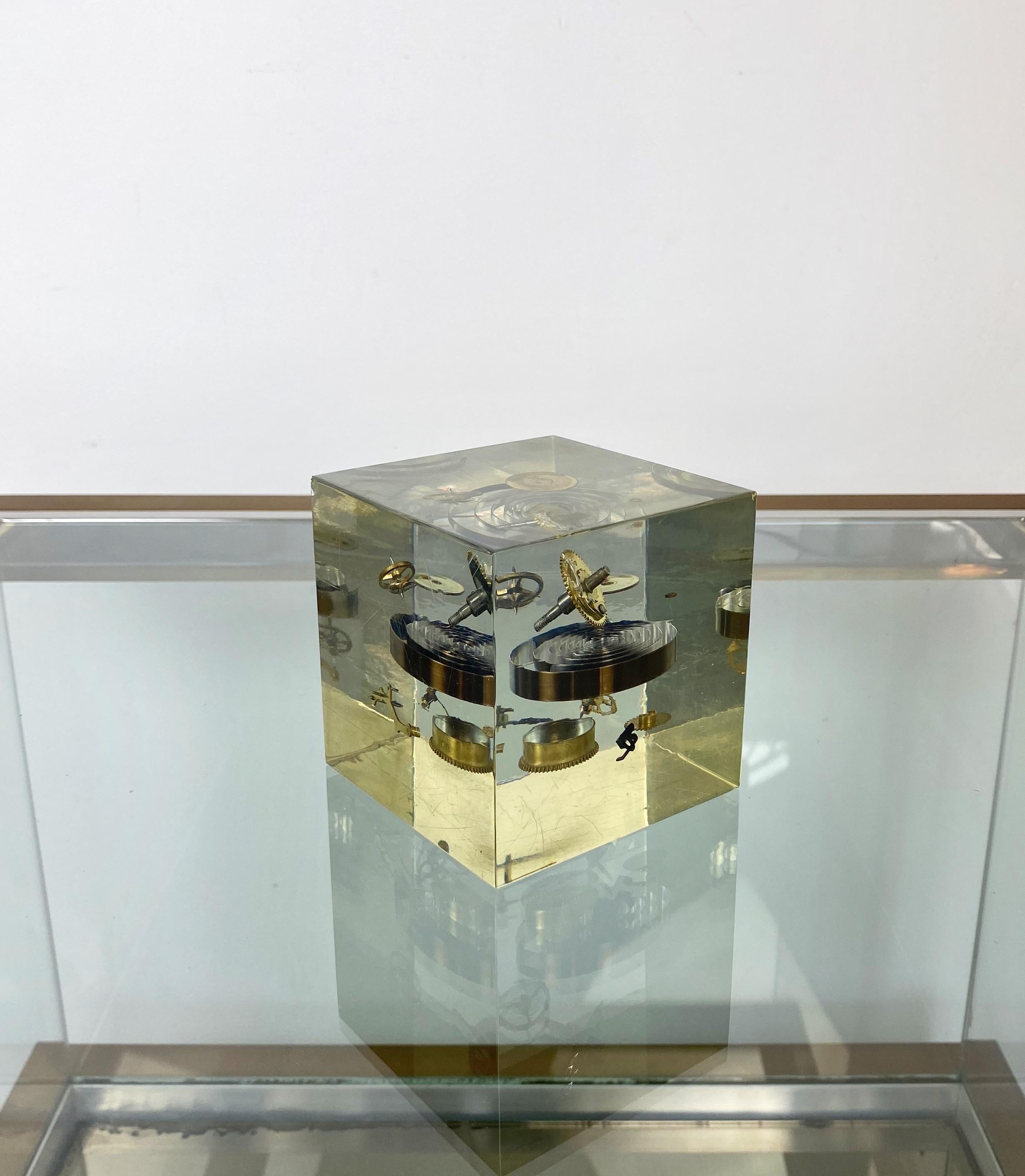 Cube sculpture with clock parts immersed in acrylic by Pierre Giraudon. Made in France, circa 1970.
