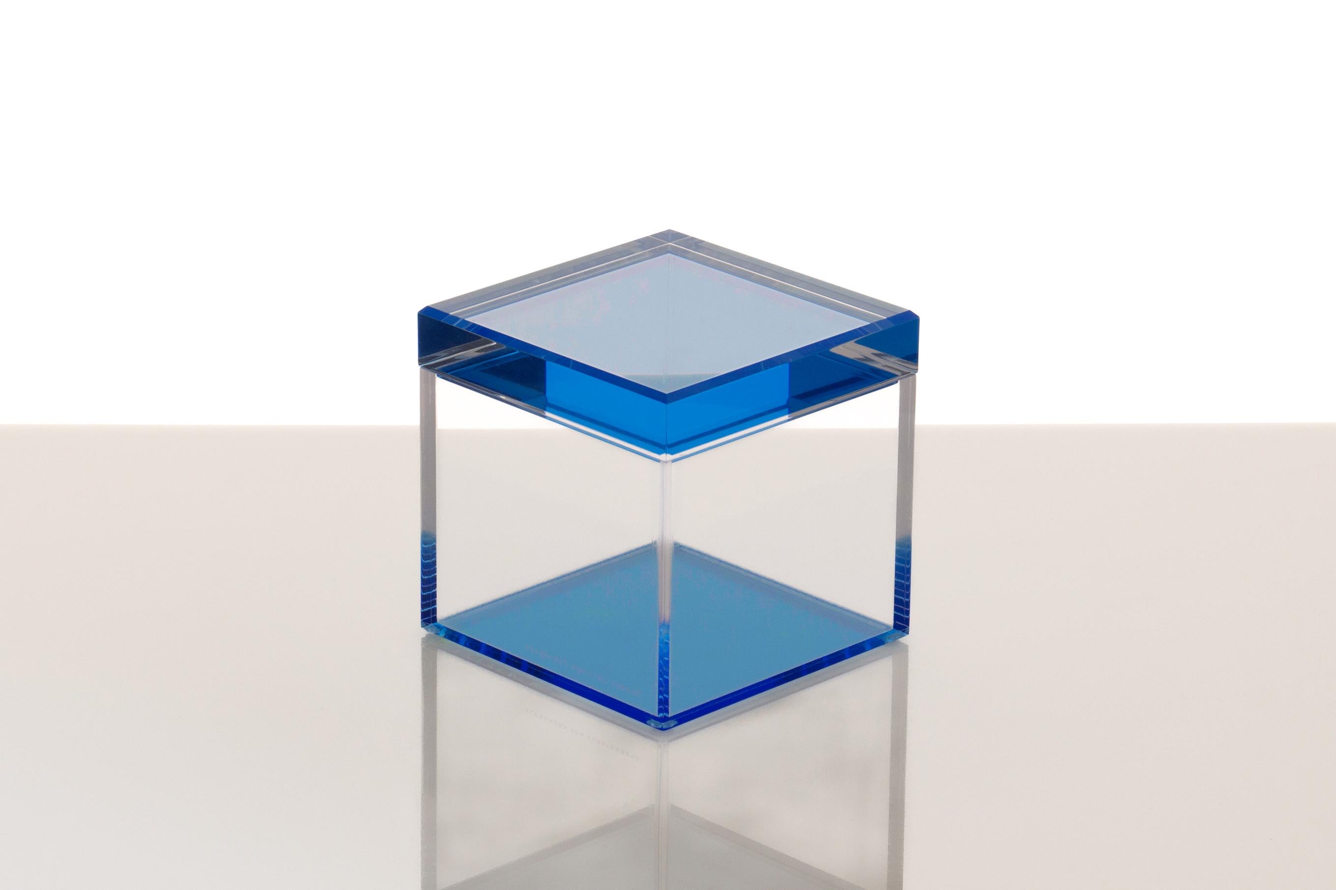 The Cubic Treasure Box in Lagoon by Alexandra Von Furstenberg a striking fusion of modern design and functional elegance. Crafted from premium acrylic, this 5