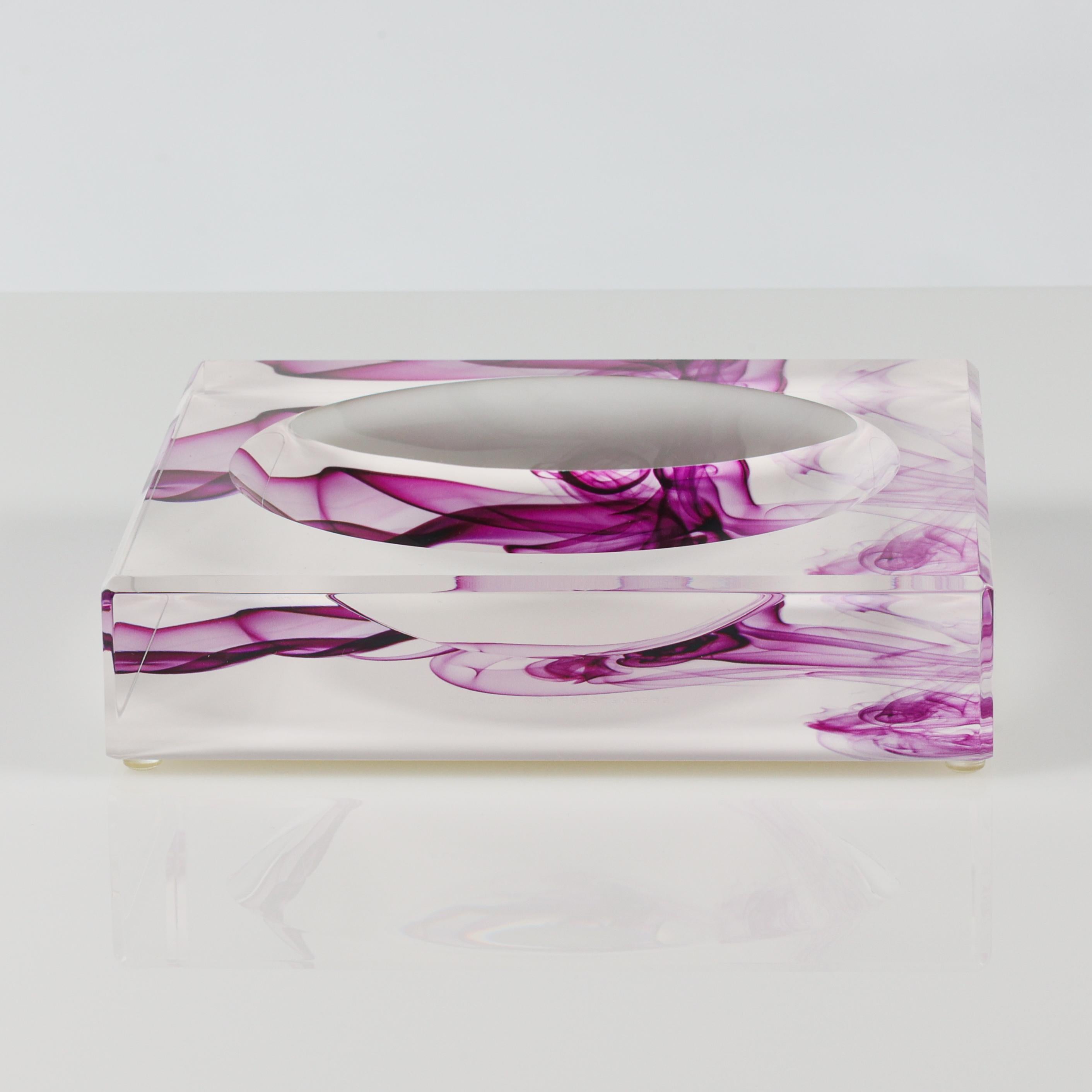 The AVF Acrylic Magenta Smoke Print Candy Bowl by Alexandra Von Furstenberg. Warm woods are always a stunning addition to any home and this petrified wood print is the perfect finishing touch to any table arrangement. This luxurious bowl is cut and