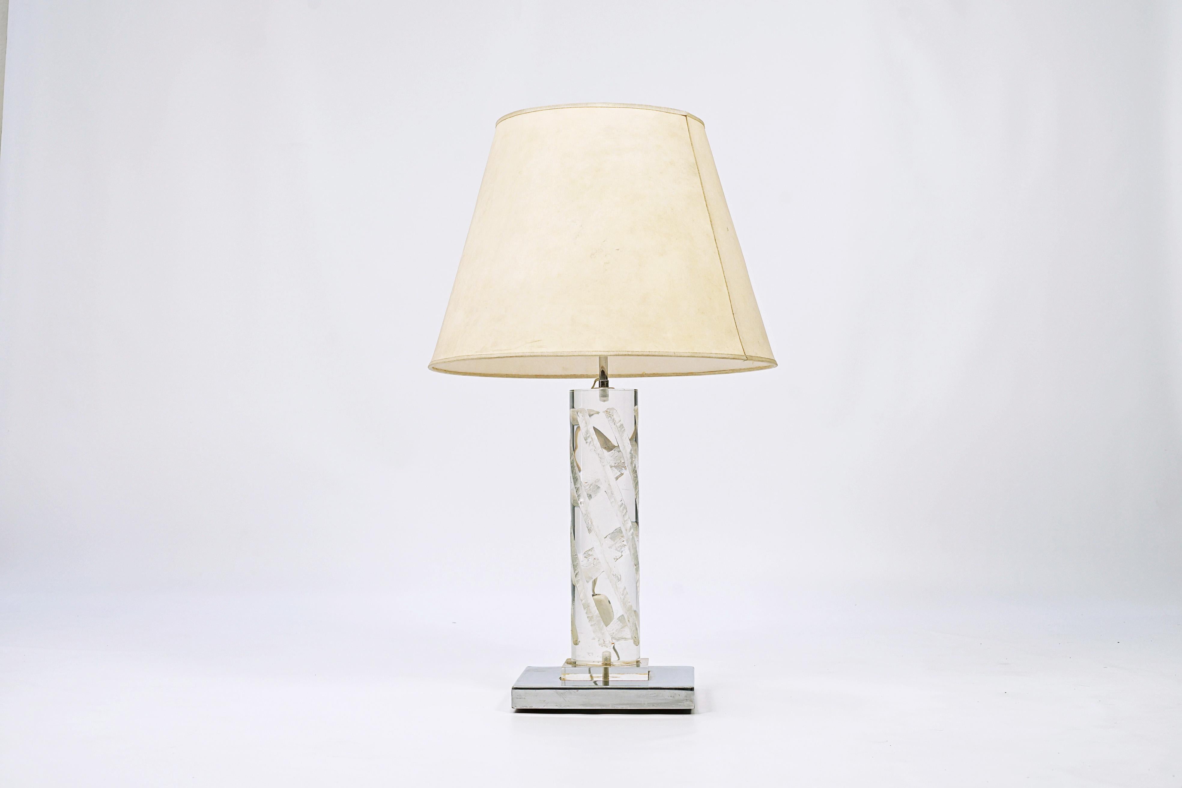 Acrilyc table lamp with a metal base. Acrylic wasn't yet as industrialized as it is now and was considered as something exotic.

Italy, CIRCA 1950.