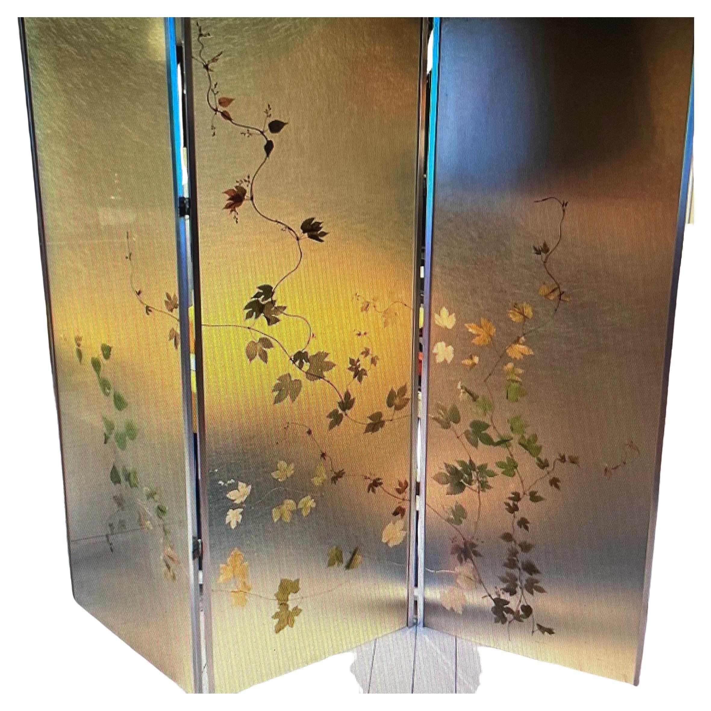 Three panels room divider. Each frosted acrylic panel contains a foliage like a herbarium.
Inox frame and hinges.
France 1970.