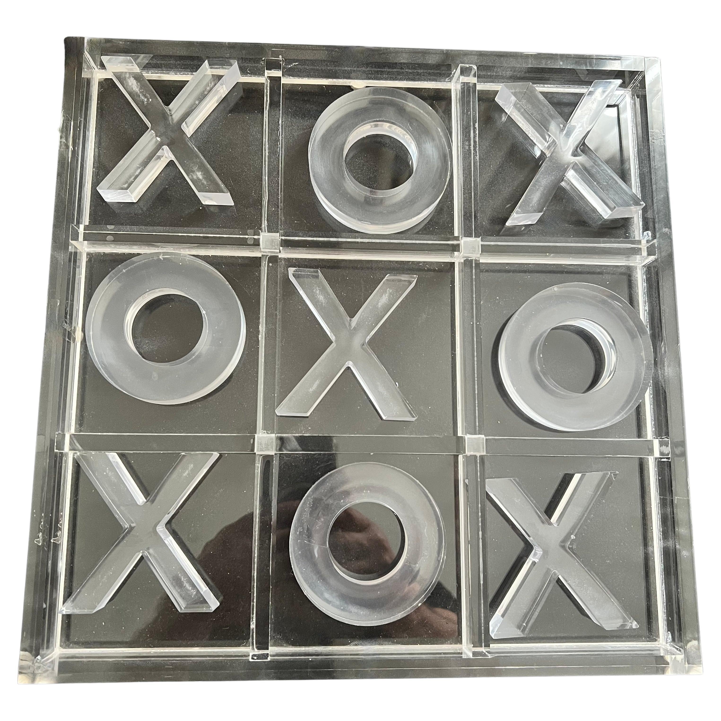 A completely acrylic Tic Tac Toe Board.   The board and all X's and O's are acrylic.  The board and pieces could be as decorative as they are practical - a compliment to many spaces and especially a Childs room. 

looks lovely on a table and a good