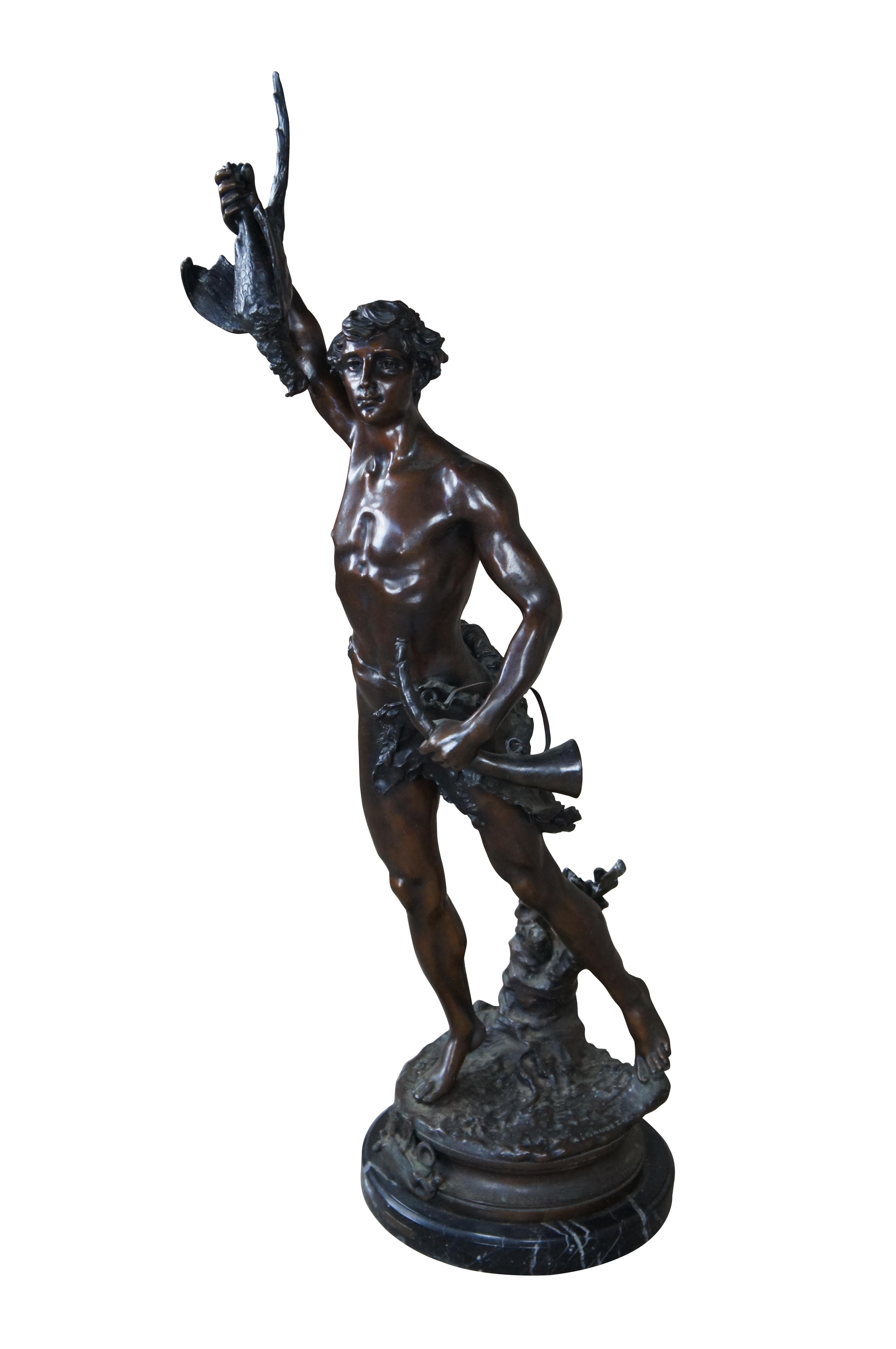 A remarkable French Bronze sculpture of Acteon by Adrein Etienne Gaudez. The statue is sculpted in lifelike detail, featuring Acteon with a bird in his outstretched arm, standing on one leg with a French horn in his other arm. Includes a neat
