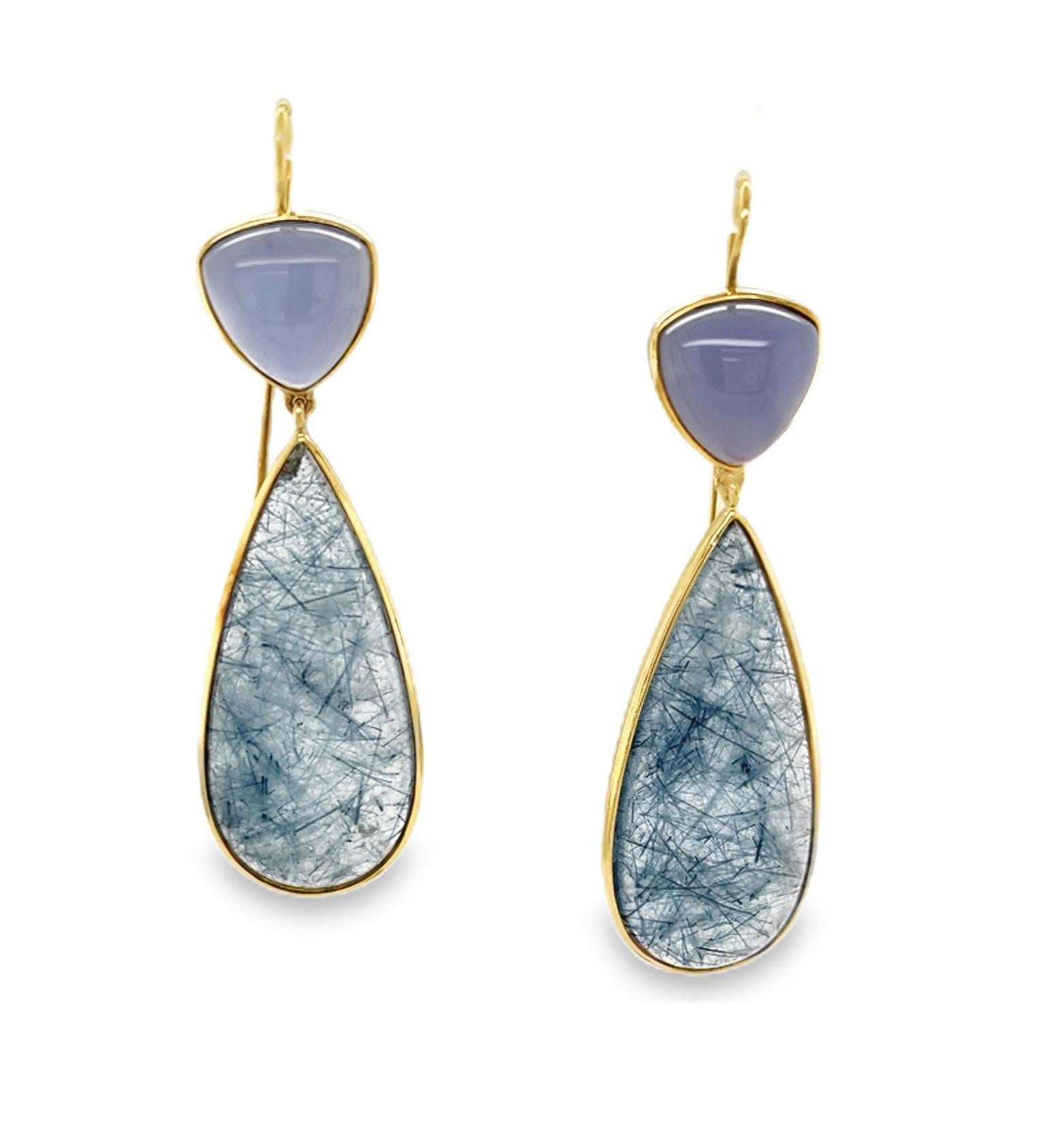 These bezel set actinolite and chalcedony cabochon drop earrings are a unique blend of color, texture and form! Translucent lavender chalcedony triangles sit atop transparent quartz pendalogues with beautiful blue actinolite needle inclusions in