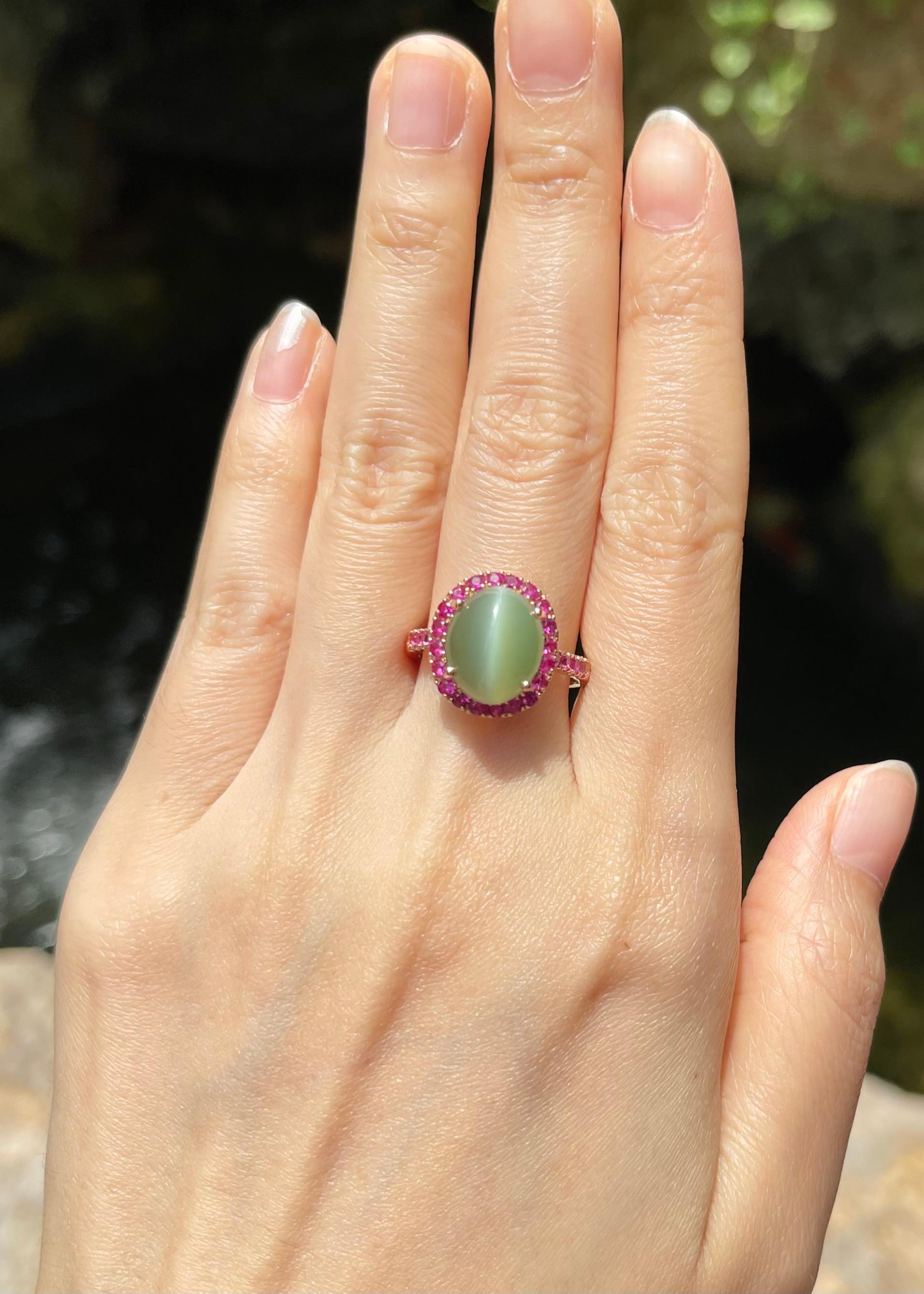 Actinolite Cat's Eye 5.01 carats with Pink Sapphire 0.78 carat Ring set in 18K Rose Gold Settings

Width:  1.3 cm 
Length: 1.5 cm
Ring Size: 55
Total Weight: 6.39 grams


