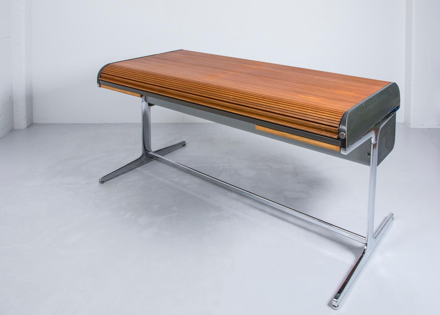This Mid-Century Modern Classic ‘Action’ office desk was designed by George Nelson as seen in Kubrick’s sci-fi masterpiece 2001: A Space Odyssey. This piece was manufactured in 1964 by Herman Miller and features a walnut top and chromed steel base.