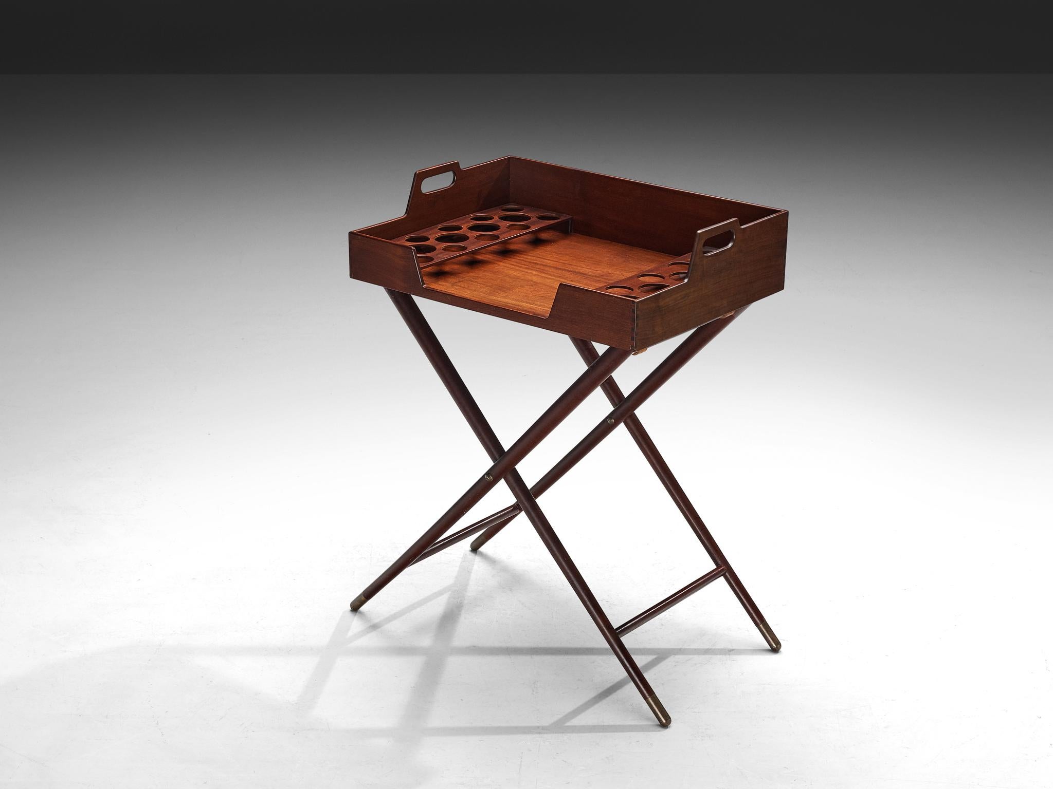 Acton Bjørn, tray table or serving table, teak, brass, leather, Denmark, 1930s

This unique tray table has a splendid construction consisting of a tray that is attached to the base with leather straps. The tray is equipped with handles allowing the