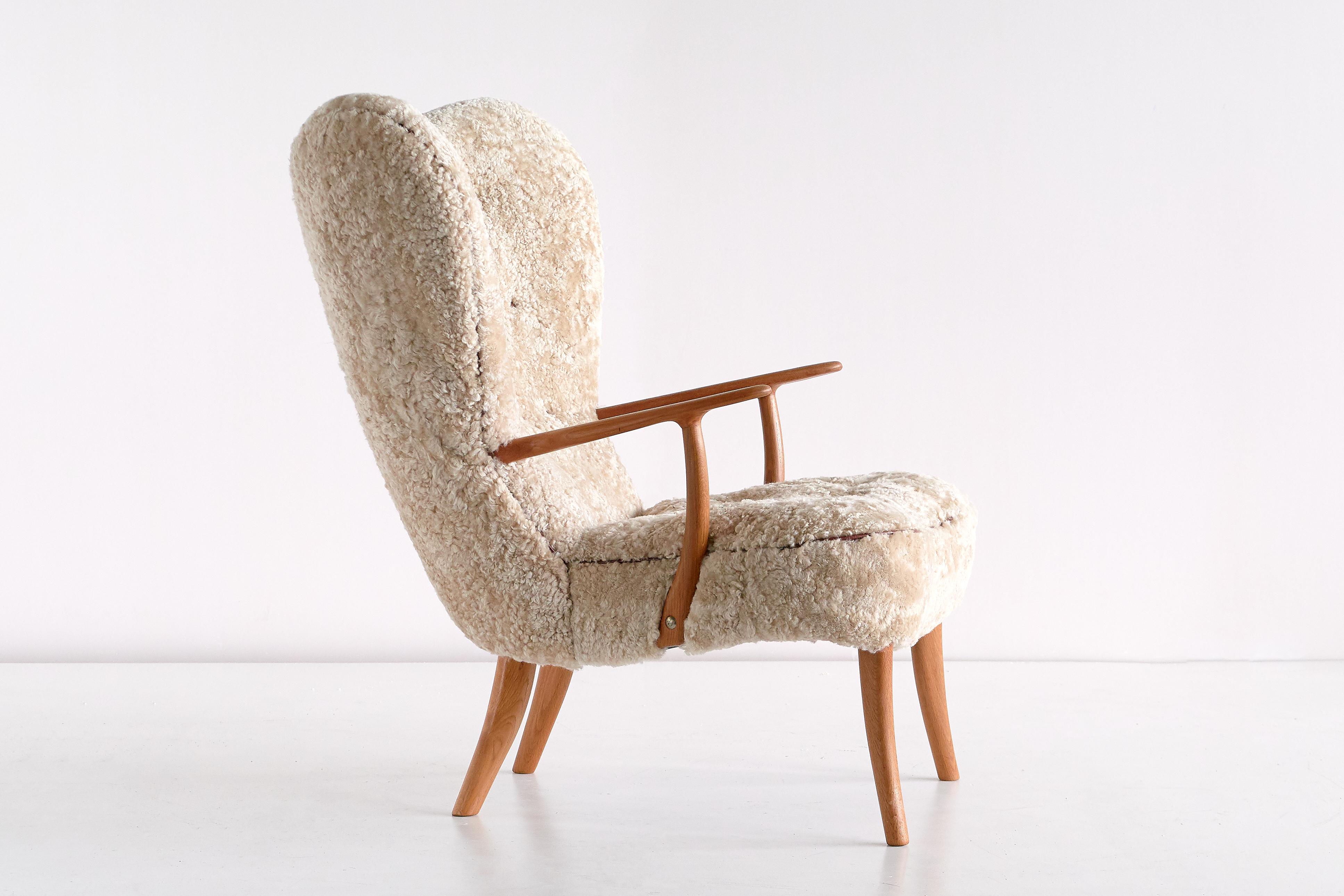 Mid-20th Century Acton Schubell & Ib Madsen 'Pragh' Wingback Chair in Sheepskin, Denmark, 1950s