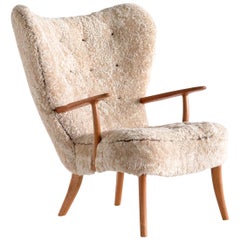 Acton Schubell & Ib Madsen 'Pragh' Wingback Chair in Sheepskin, Denmark, 1950s