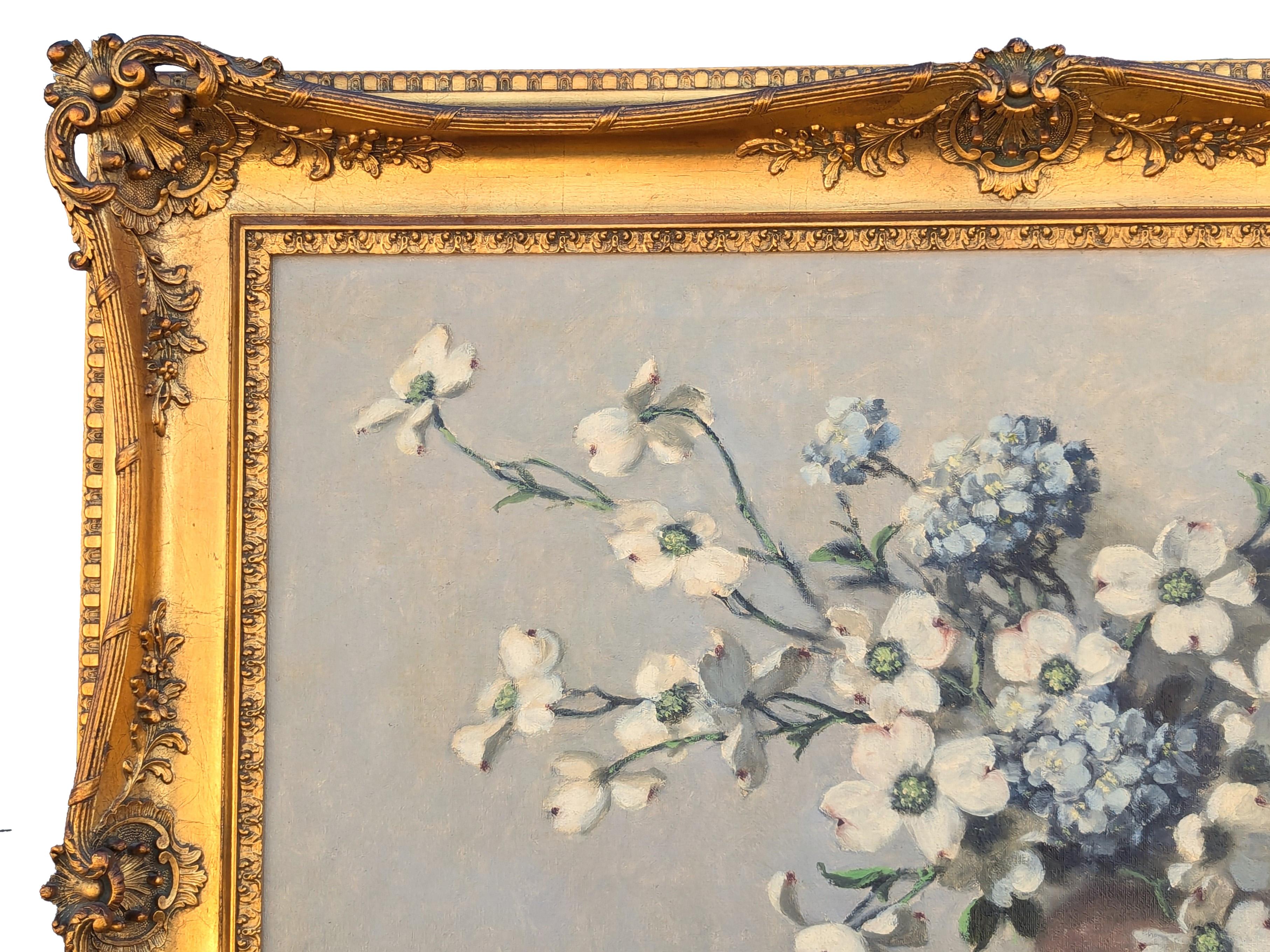 Green and white realistic floral still life painting by American artist A.D. Greer. The work features dogwood blossoms displayed in vases with green drapery arranged around them. Signed by the artist in the front lower right corner. Currently hung