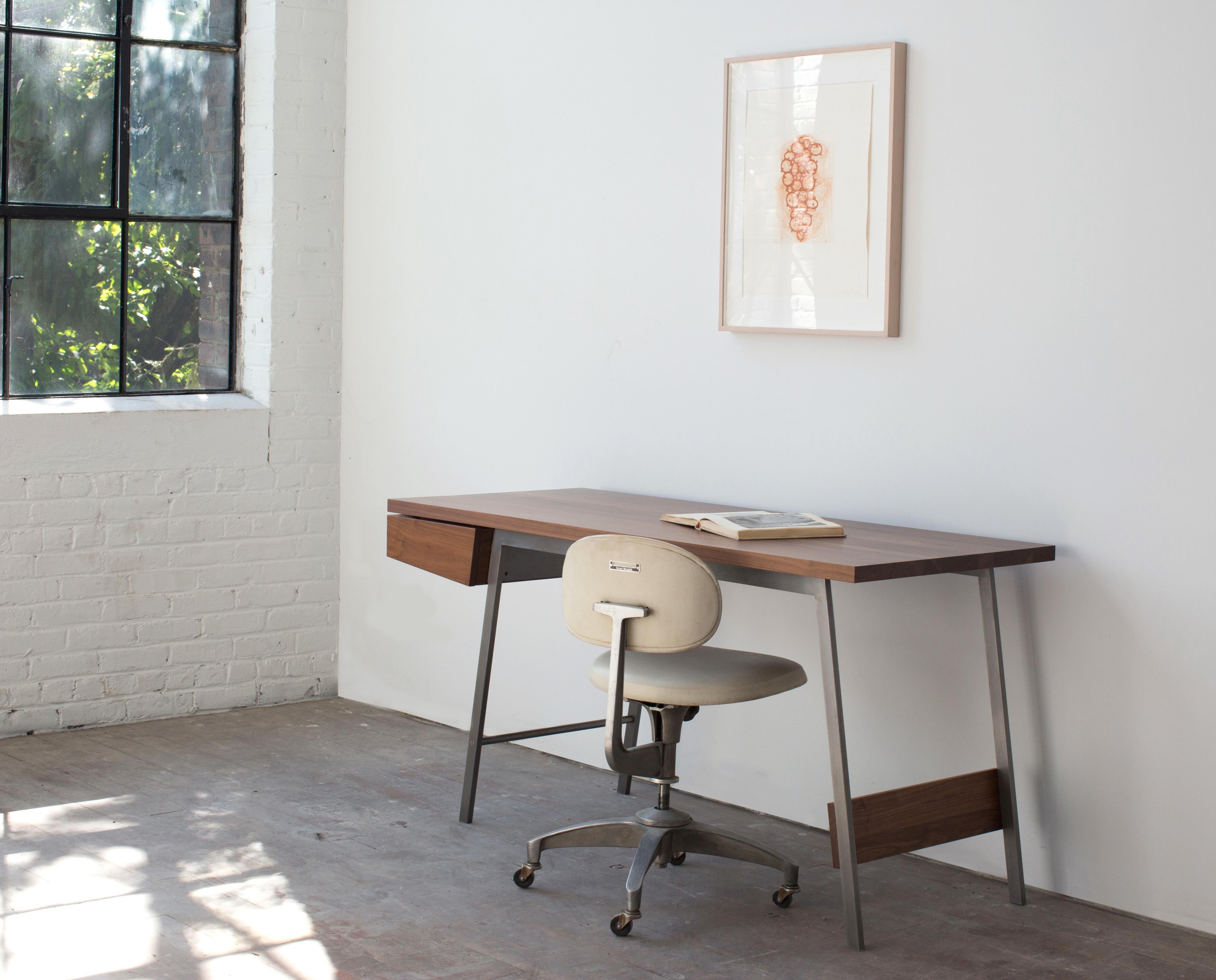 Spare, refined, and meticulously handcrafted of solid hardwoods and steel, the AD7 desk is distinguished by superb detailing, the finest materials and timeless design. The composition plays with the relationship between positive and negative space,