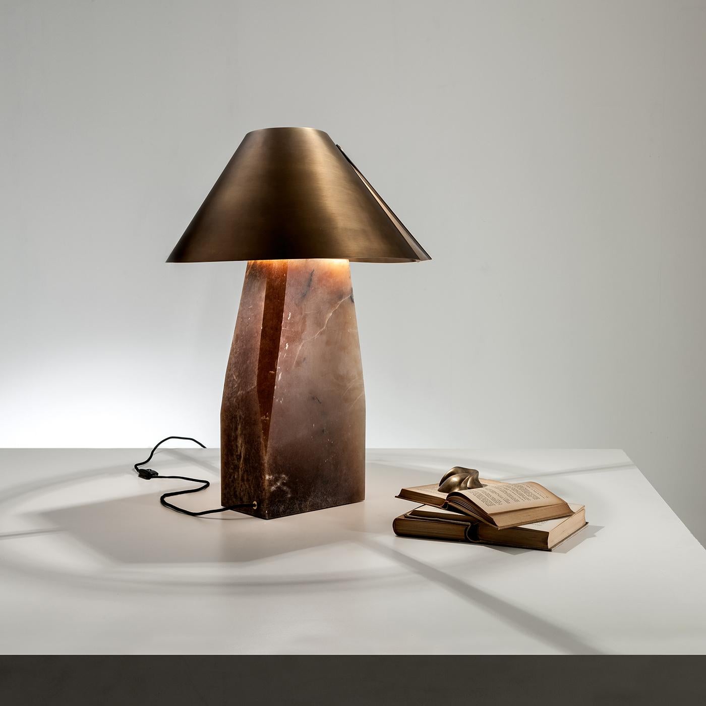 This astonishing Ada table lamp by Cesare Arosio combines ancient and modern elements in a design of timeless elegance and visual allure. The sculptural alabaster base supports an exquisite satin-burnished brass coolie lampshade. A polyhedral form