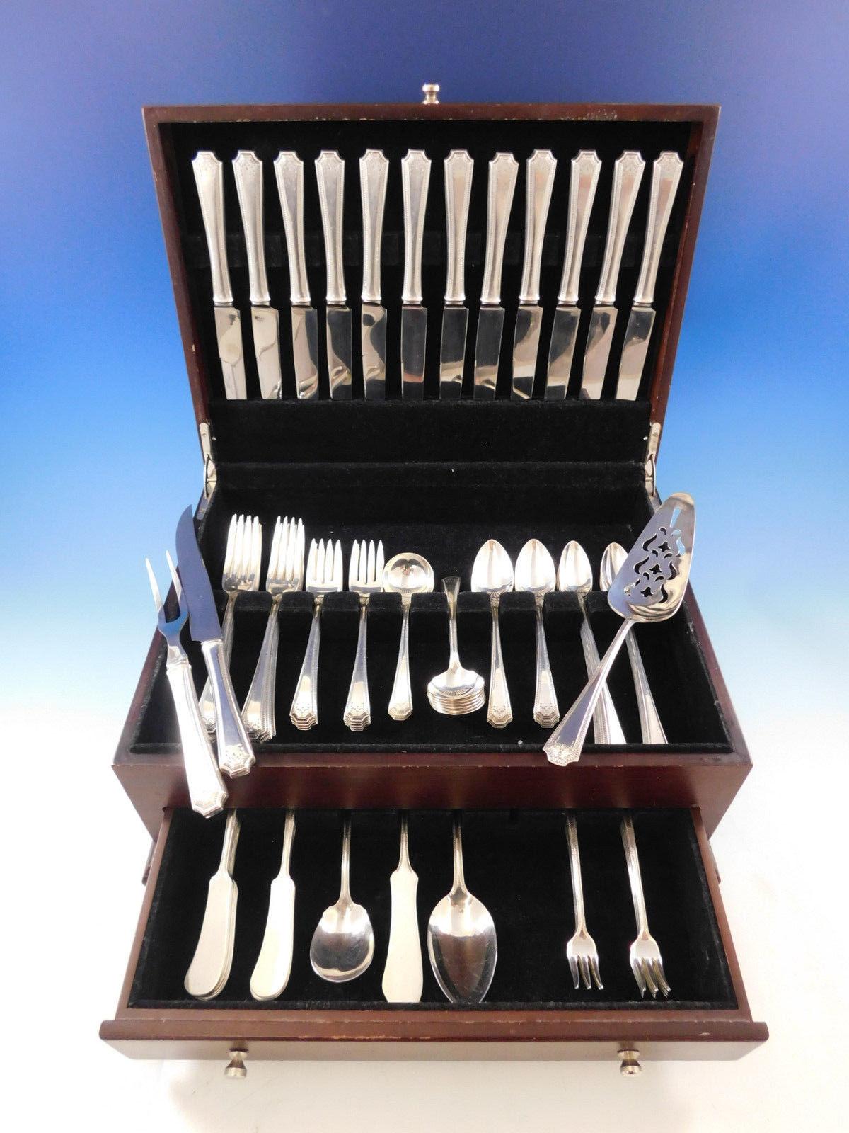 Monumental dinner size Adam by National circa 1917 sterling silver flatware set of 102 pieces. This set includes:

12 dinner size knives, 9 1/2