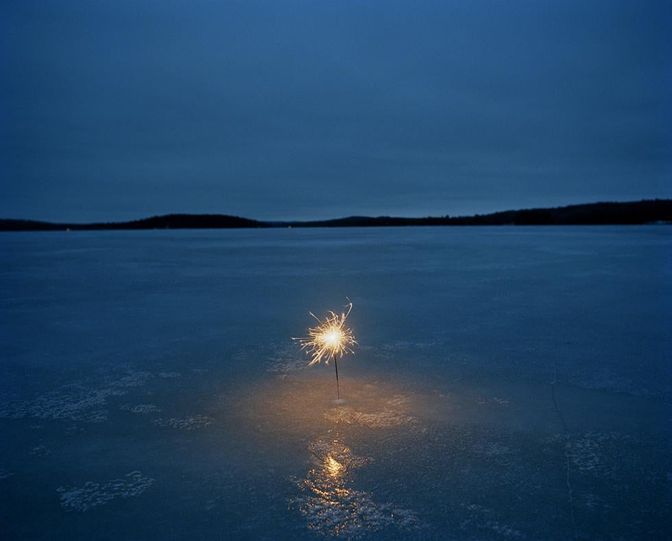 Adam Ekberg Color Photograph - A Sparkler on a Frozen Lake