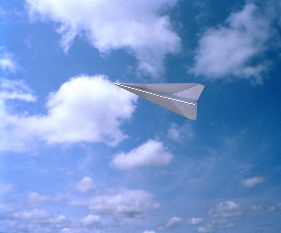 Adam Ekberg Color Photograph - Paper Airplane