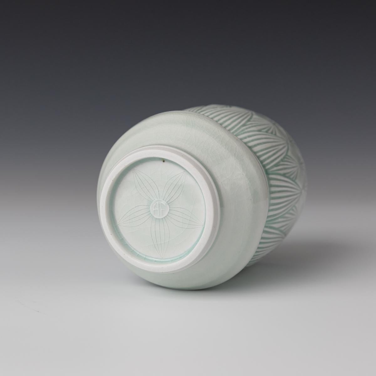 This elegant jar was created by Montana based ceramicist, Adam Field. The jar incorporates Field's love of ancient pottery entwined with the functionality of Colonial American Ware. Inspired by nature, many of Field's forms contain a variety of