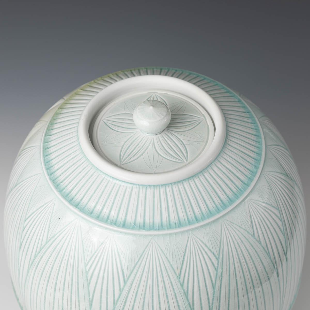Large Covered Porcelain Jar with Lid- celedon glazed, hand carved, porcelain - Contemporary Sculpture by Adam Field
