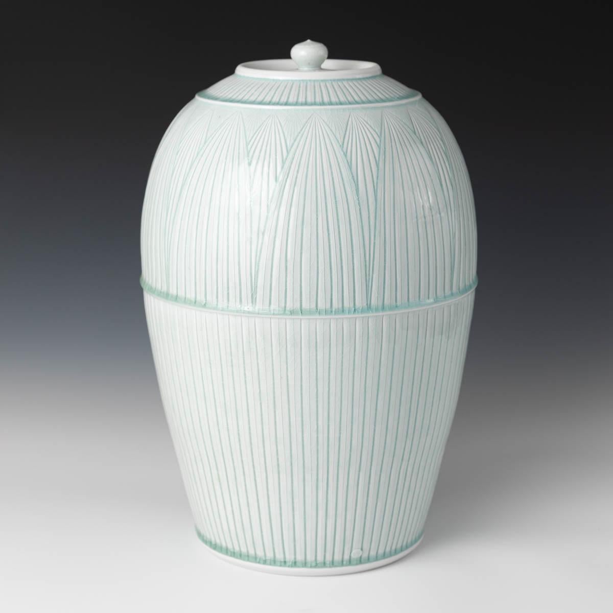 Adam Field Abstract Sculpture - Large Covered Porcelain Jar with Lid- celedon glazed, hand carved, porcelain