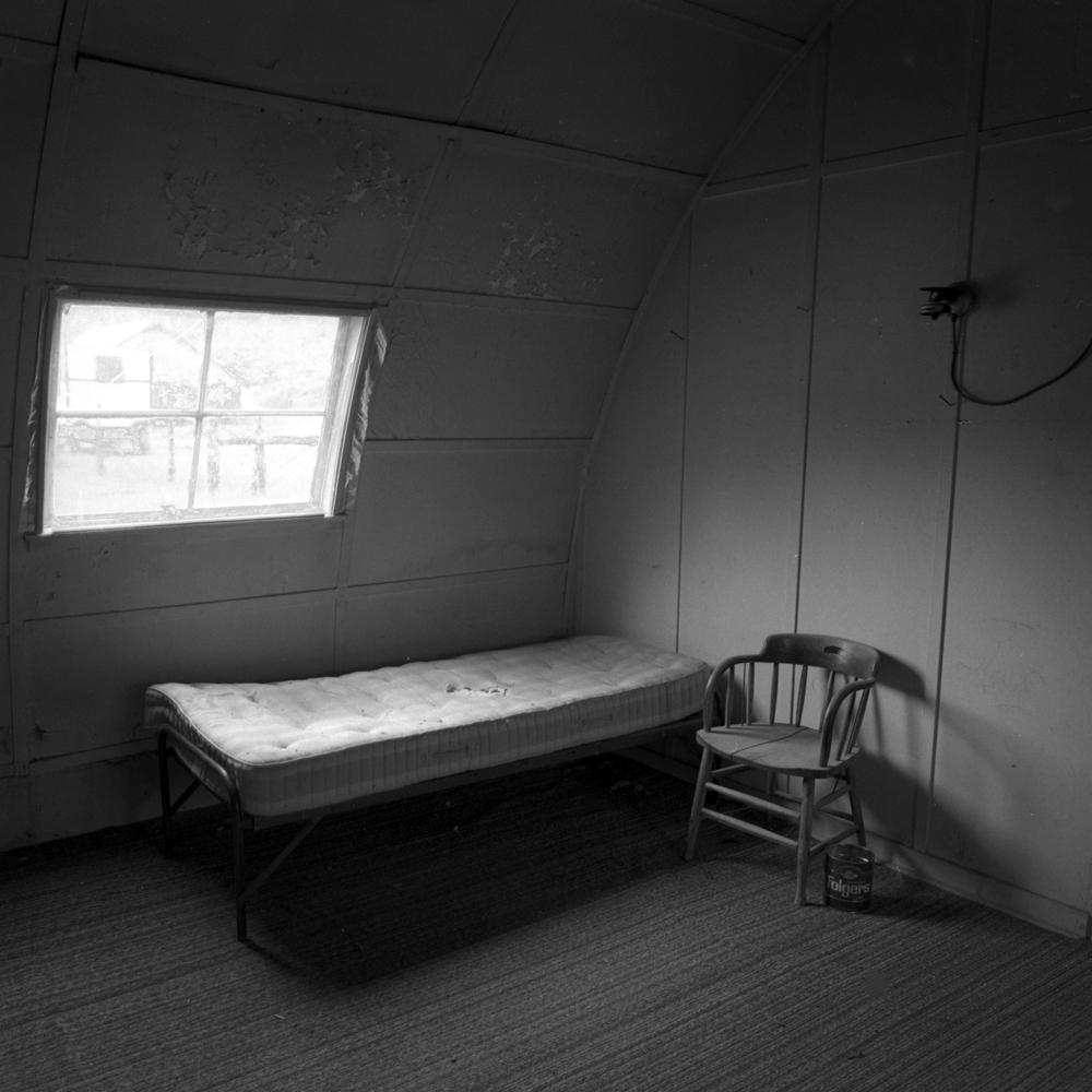 Adam Jahiel Black and White Photograph - Empty Bunk, IL Ranch, NV
