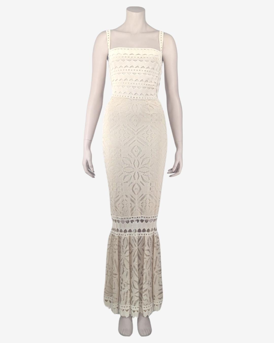 Adam Jones Paris Maxi Cut Out Knit Dress. Adam Jones was the designer behind the knit of Christian Dior during 8 years. In 2001, he launched Adam Jones Paris and this dress was one of its collection Tahiti.

. Cutouts on each sides
· Open Back
. No